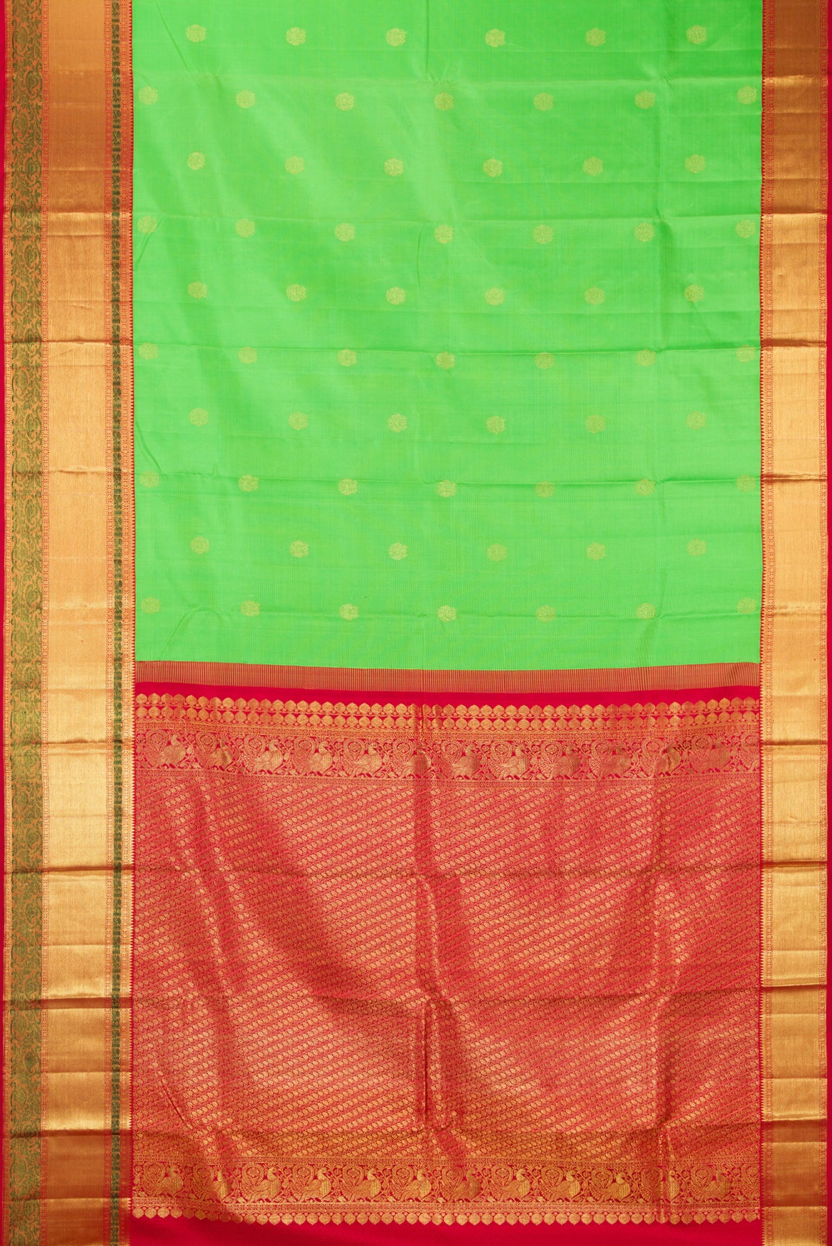 Flat view of Pure Silk Parrot Green Kanjivaram Saree with Zari Butta on the body and Zari Border. 