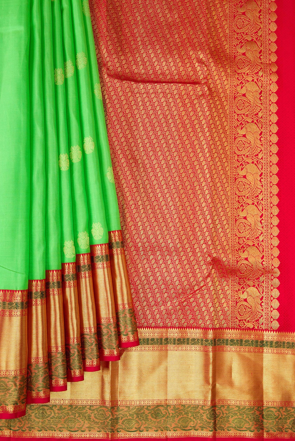 Pleats and pallu of Pure Silk Parrot Green Kanjivaram Saree with Zari Butta on the body and Zari Border. 