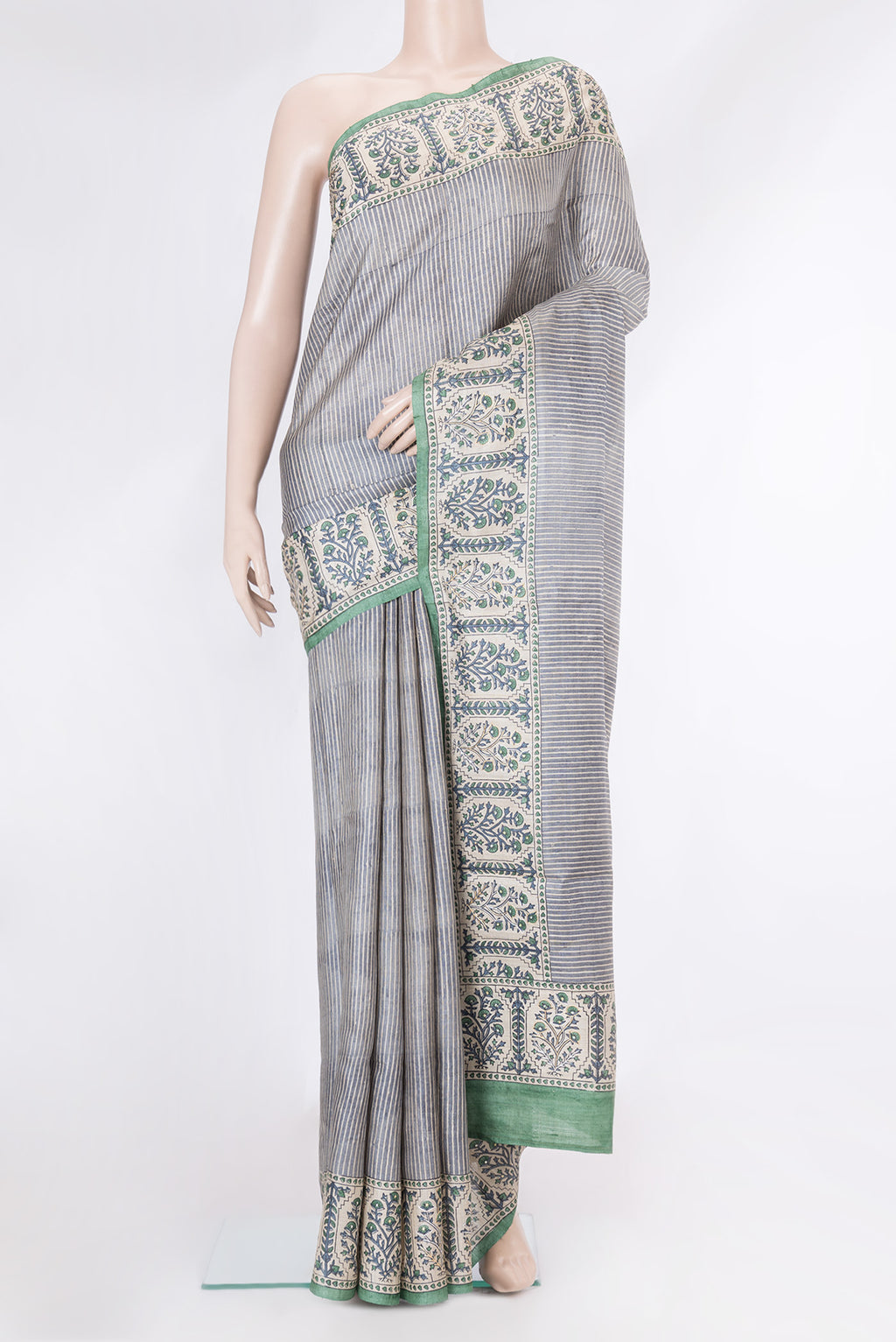 Grey Dual Tone Tussar Silk Saree with Stripes on the body and Embroidery Border.  displayed on a mannequin