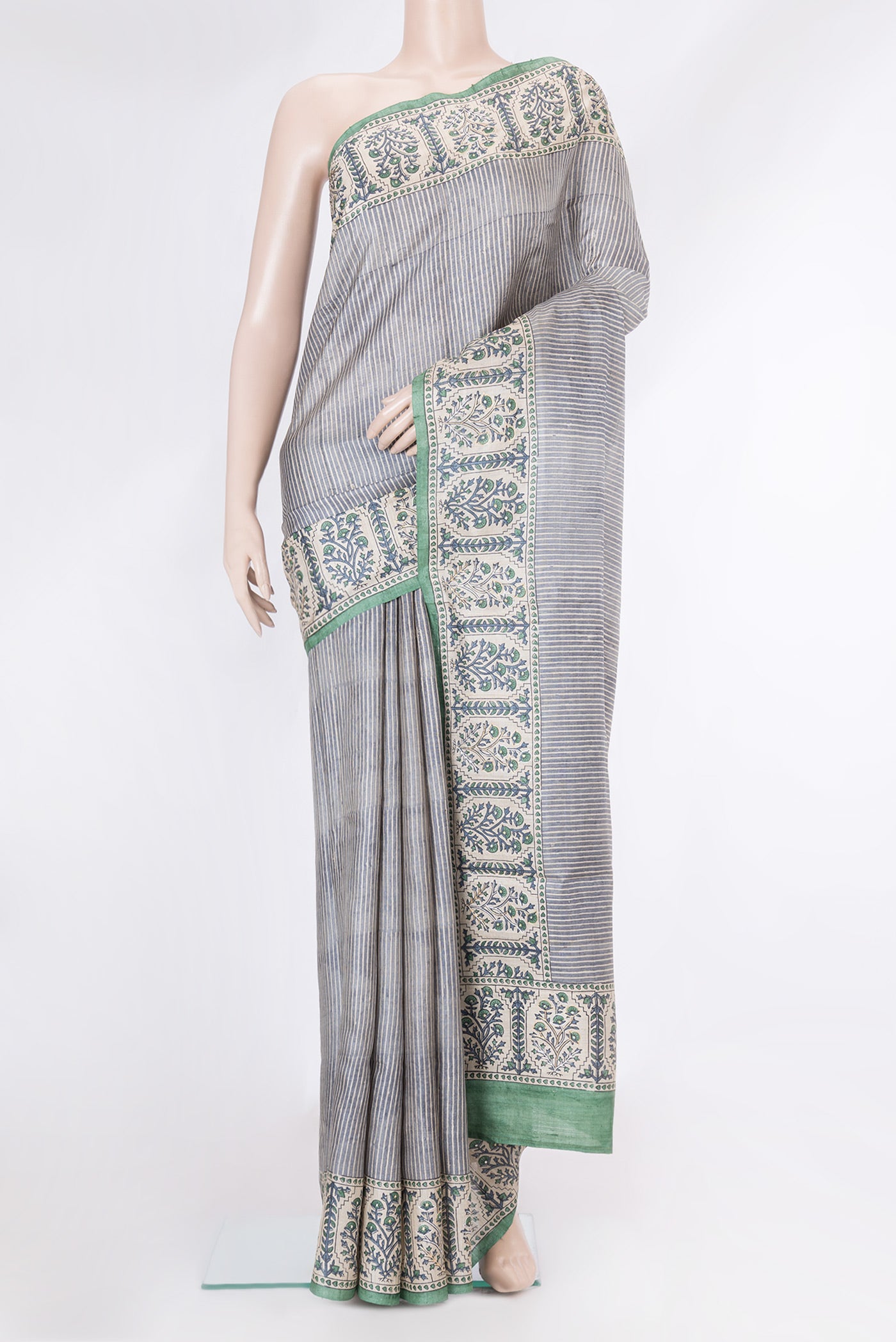 Grey Dual Tone Tussar Silk Saree with Stripes on the body and Embroidery Border.  displayed on a mannequin