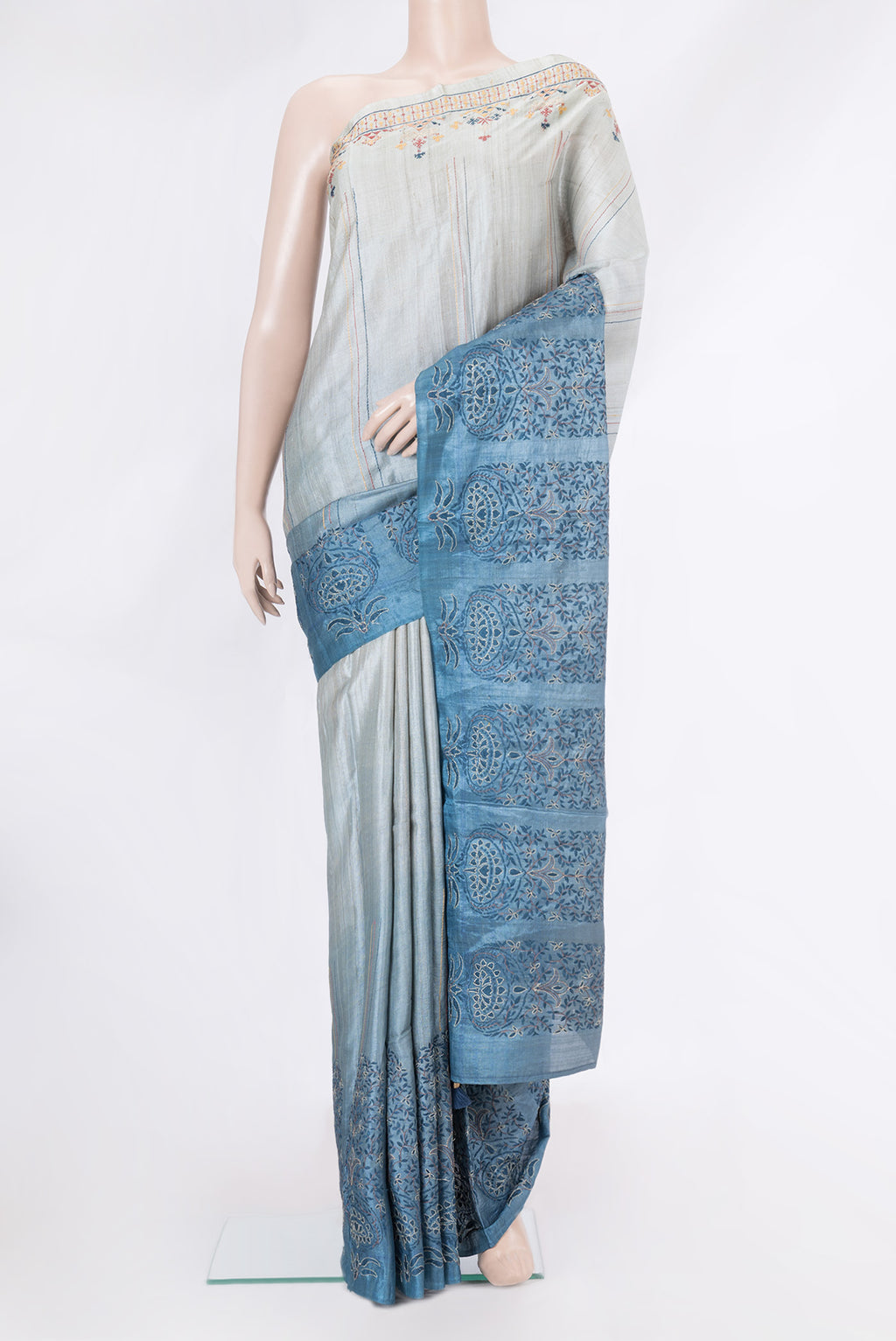 Grey Dual Tone Tussar Silk Saree with Embroidery on the body and Fancy Border.  displayed on a mannequin