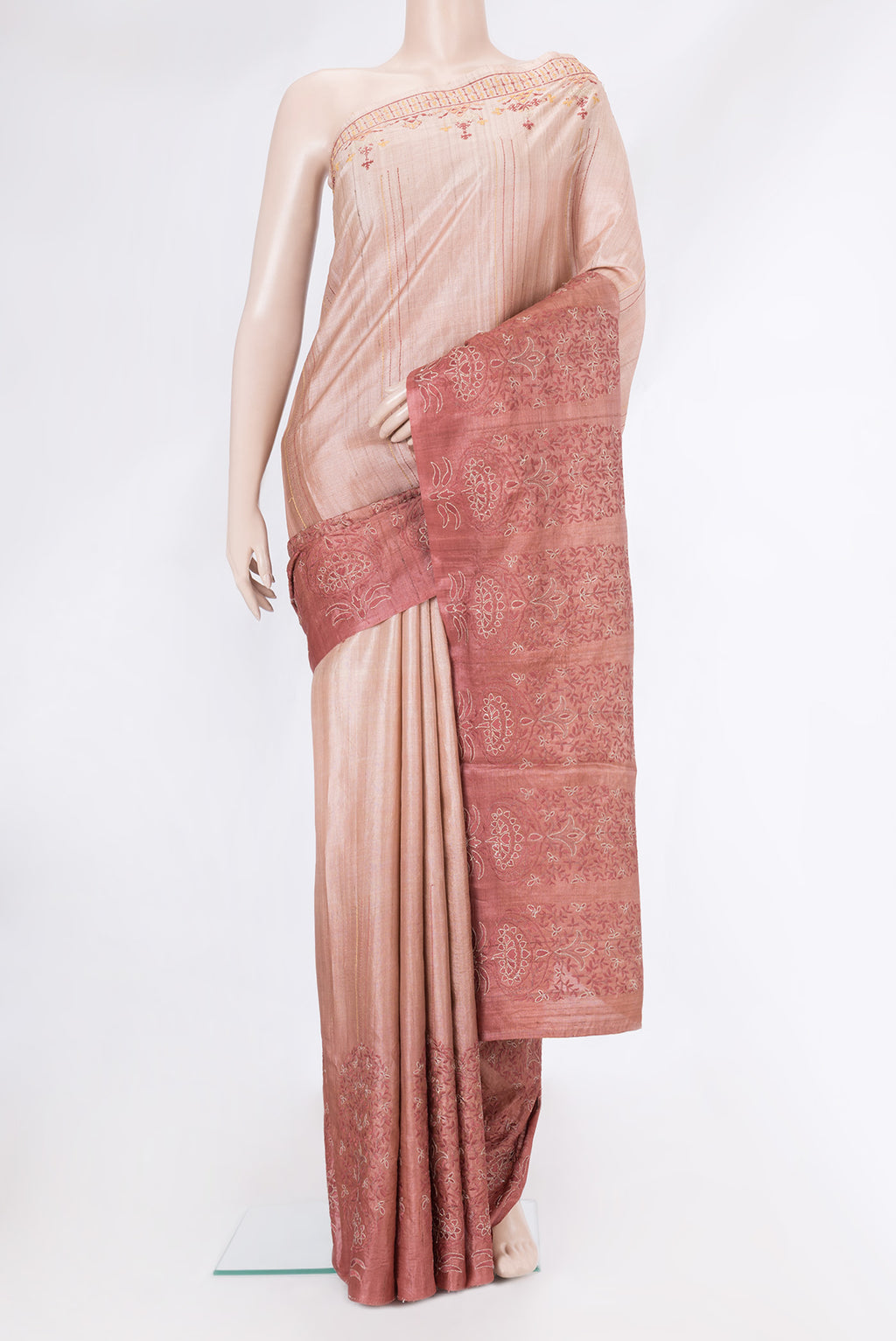 Rose Gold Dual Tone Tussar Silk Saree with Embroidery on the body and Fancy Border.  displayed on a mannequin