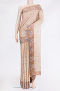 Beige Tussar Silk Saree with Embroidery on the body and Embroidery Border.  displayed on a mannequin