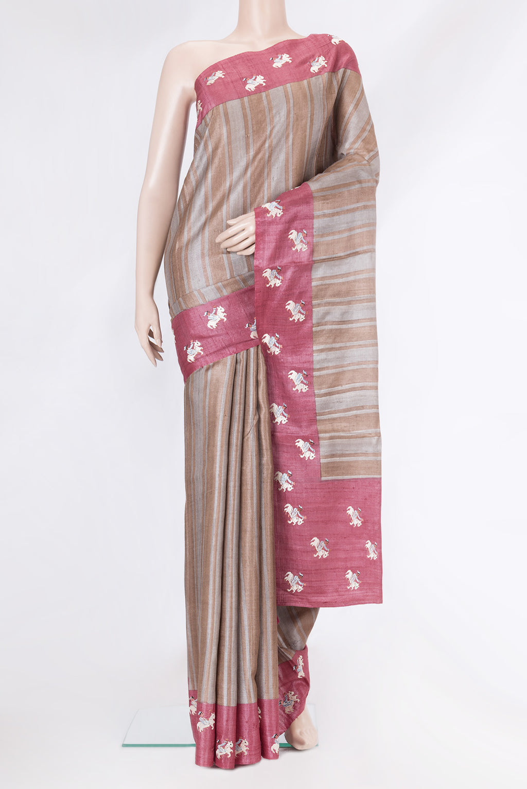 Grey Dual Tone Tussar Silk Saree with Stripes on the body and Embroidery Border.  displayed on a mannequin