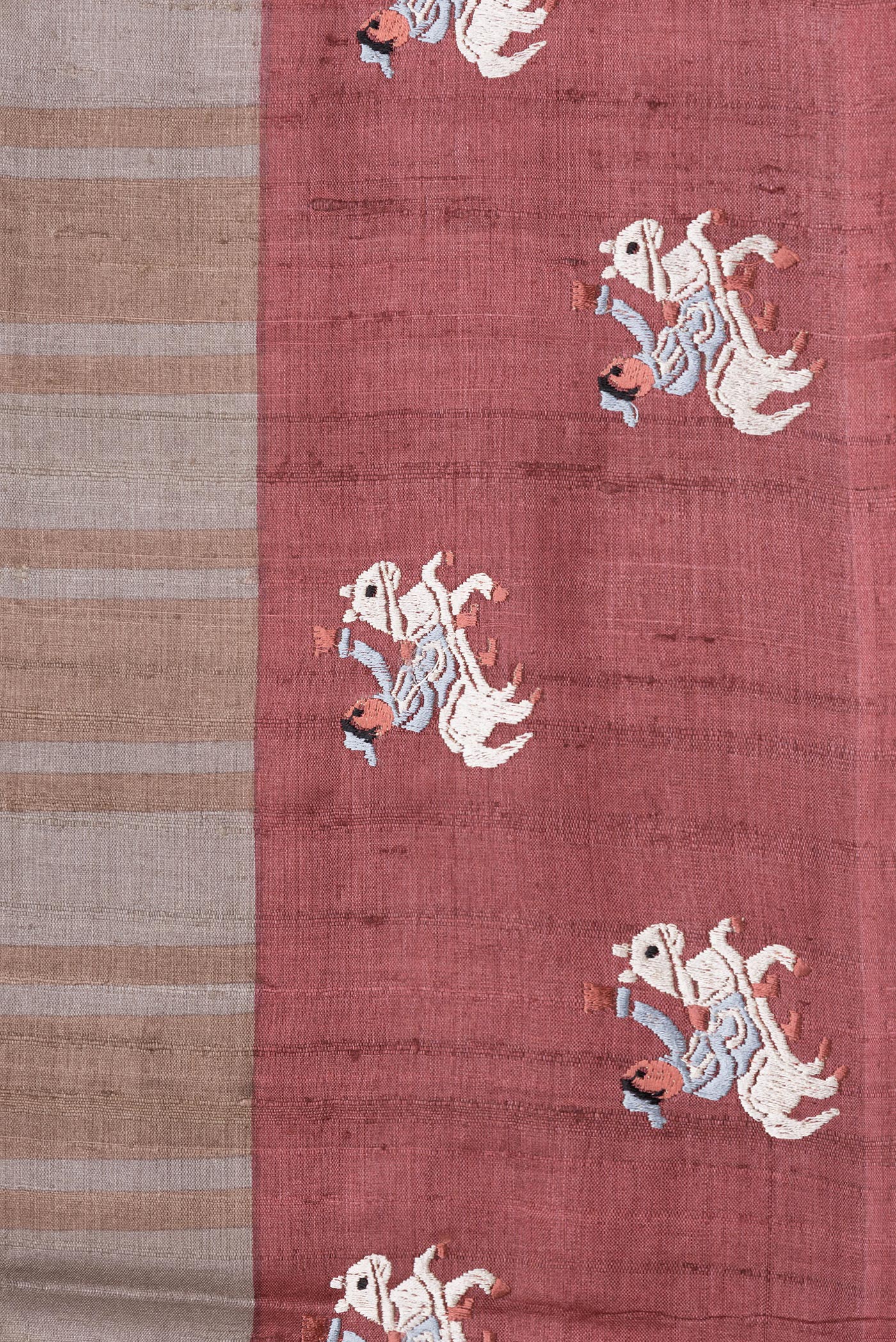 Border image of Grey Dual Tone Tussar Silk Saree with Stripes on the body and Embroidery Border. 