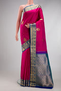 Pink Kanjivaram Silk Saree with Zari Butta on the body and Zari Border.  displayed on a mannequin