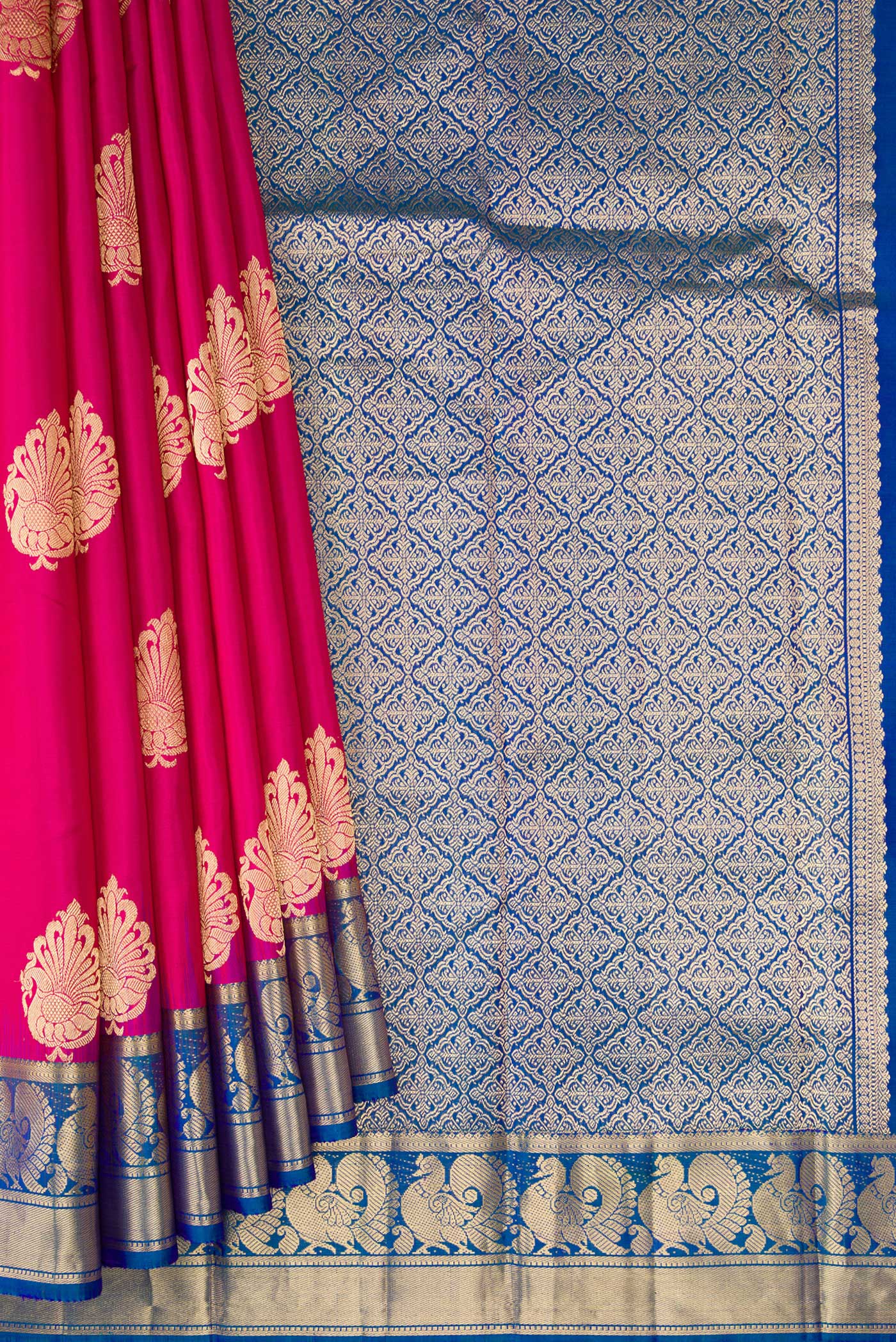 Pleats and pallu of Pink Kanjivaram Silk Saree with Zari Butta on the body and Zari Border. 
