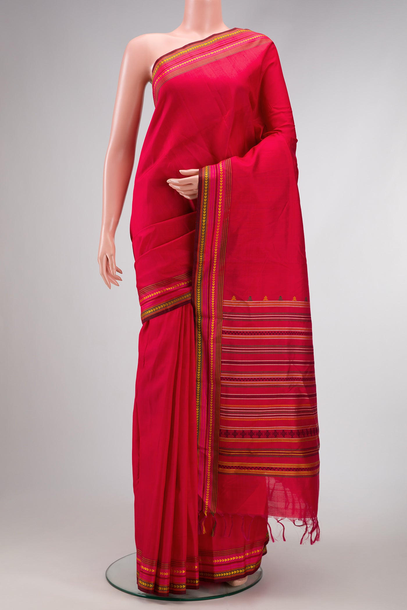 Red Dual Tone Kanchipuram Silk Saree with Plain Body and Thread Border.  displayed on a mannequin