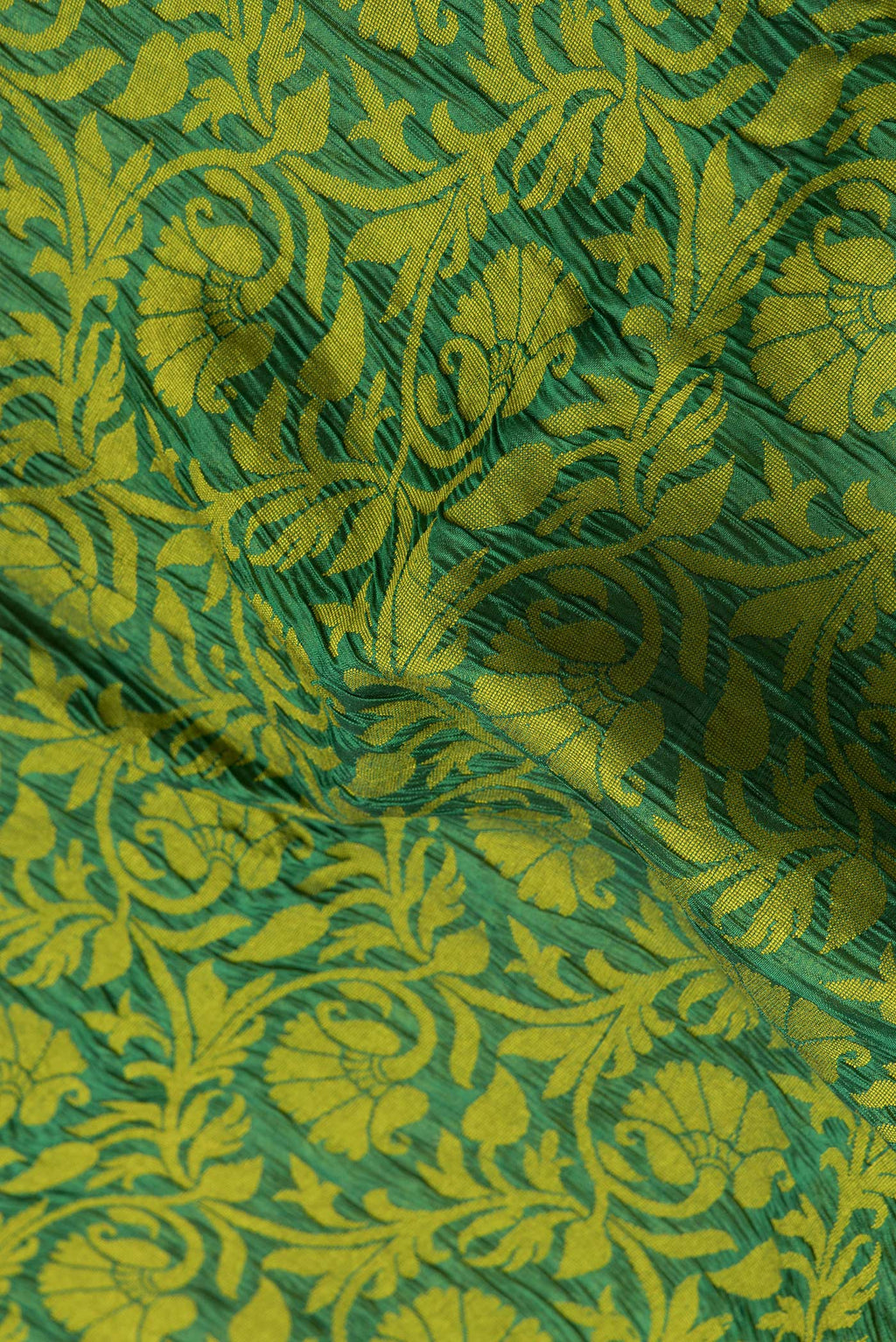 Close up of Bottle Green Dual Tone Tussar Silk Saree with Jacquard design on the body and Zari Border.  displaying folds