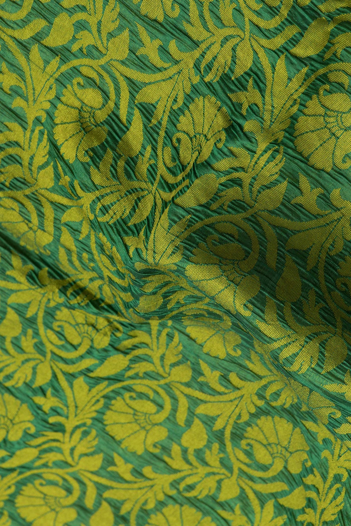 Close up of Bottle Green Dual Tone Tussar Silk Saree with Jacquard design on the body and Zari Border.  displaying folds