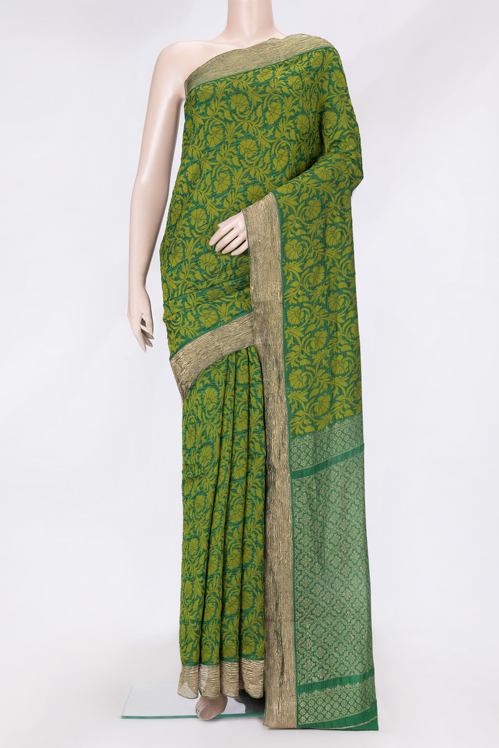 Bottle Green Dual Tone Tussar Silk Saree with Jacquard design on the body and Zari Border.  displayed on a mannequin