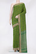 Bottle Green Dual Tone Tussar Silk Saree with Jacquard design on the body and Zari Border.  displayed on a mannequin