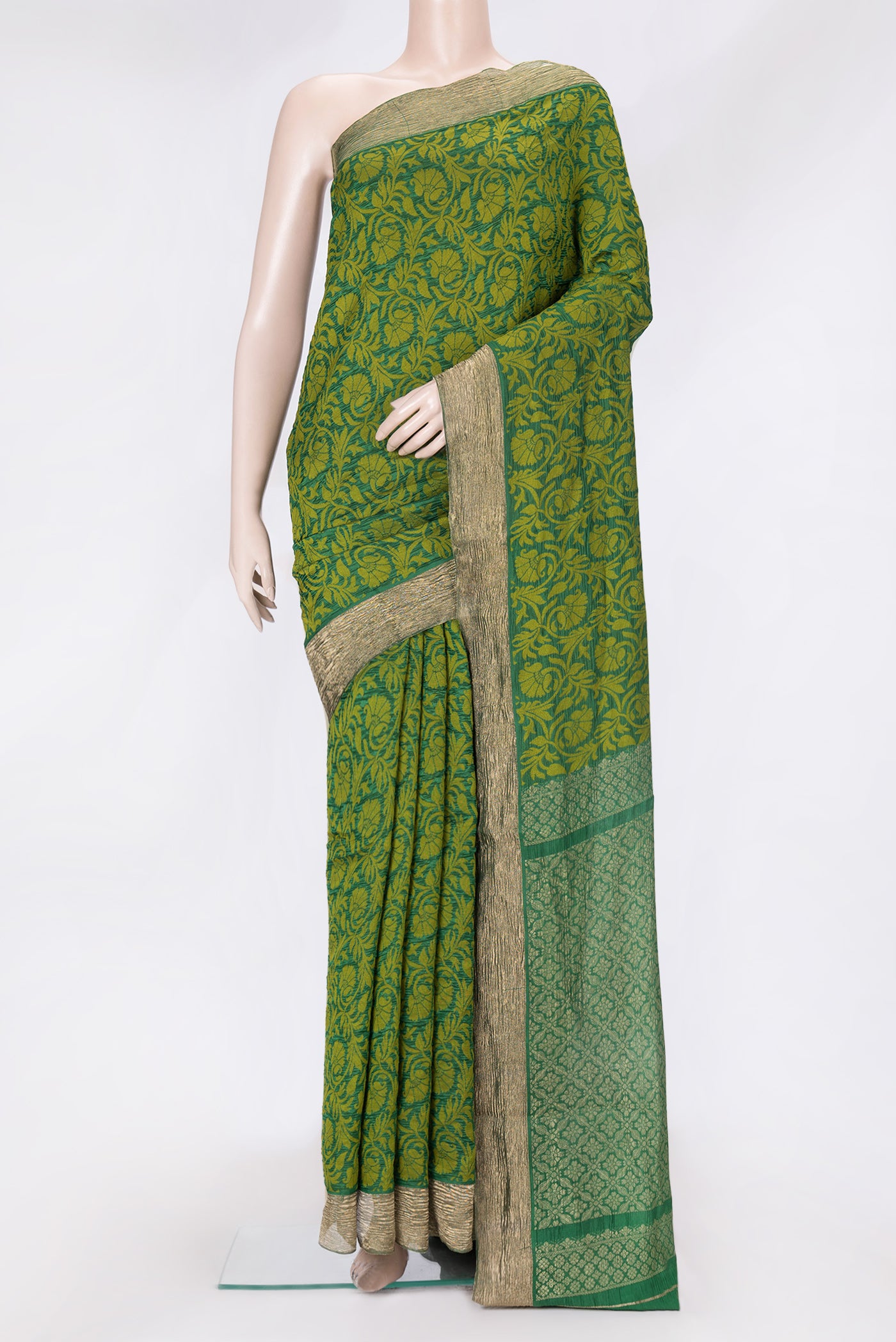 Bottle Green Dual Tone Tussar Silk Saree with Jacquard design on the body and Zari Border.  displayed on a mannequin
