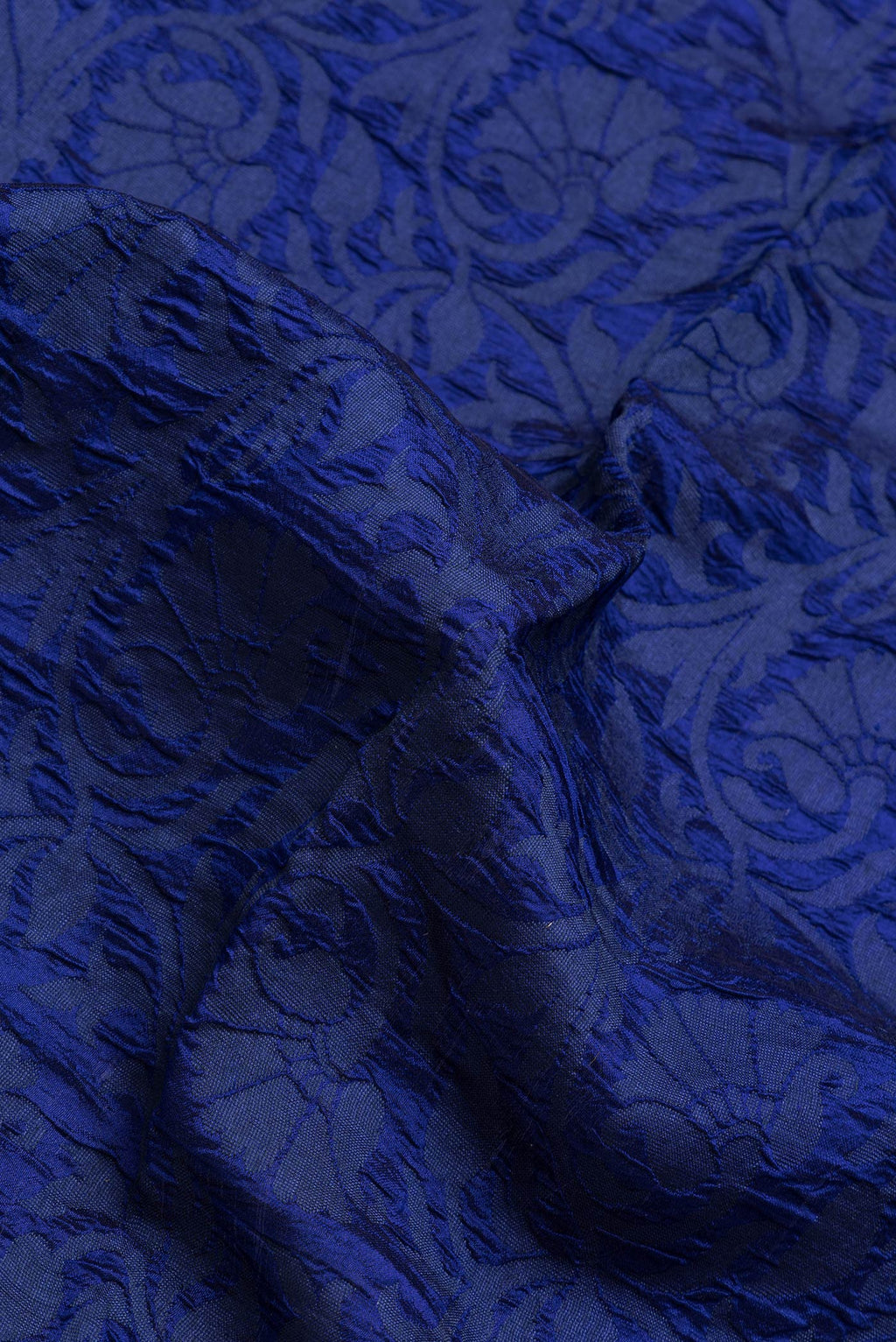 Close up of Navy Blue Dual Tone Tussar Silk Saree with Jacquard design on the body and Zari Border.  displaying folds