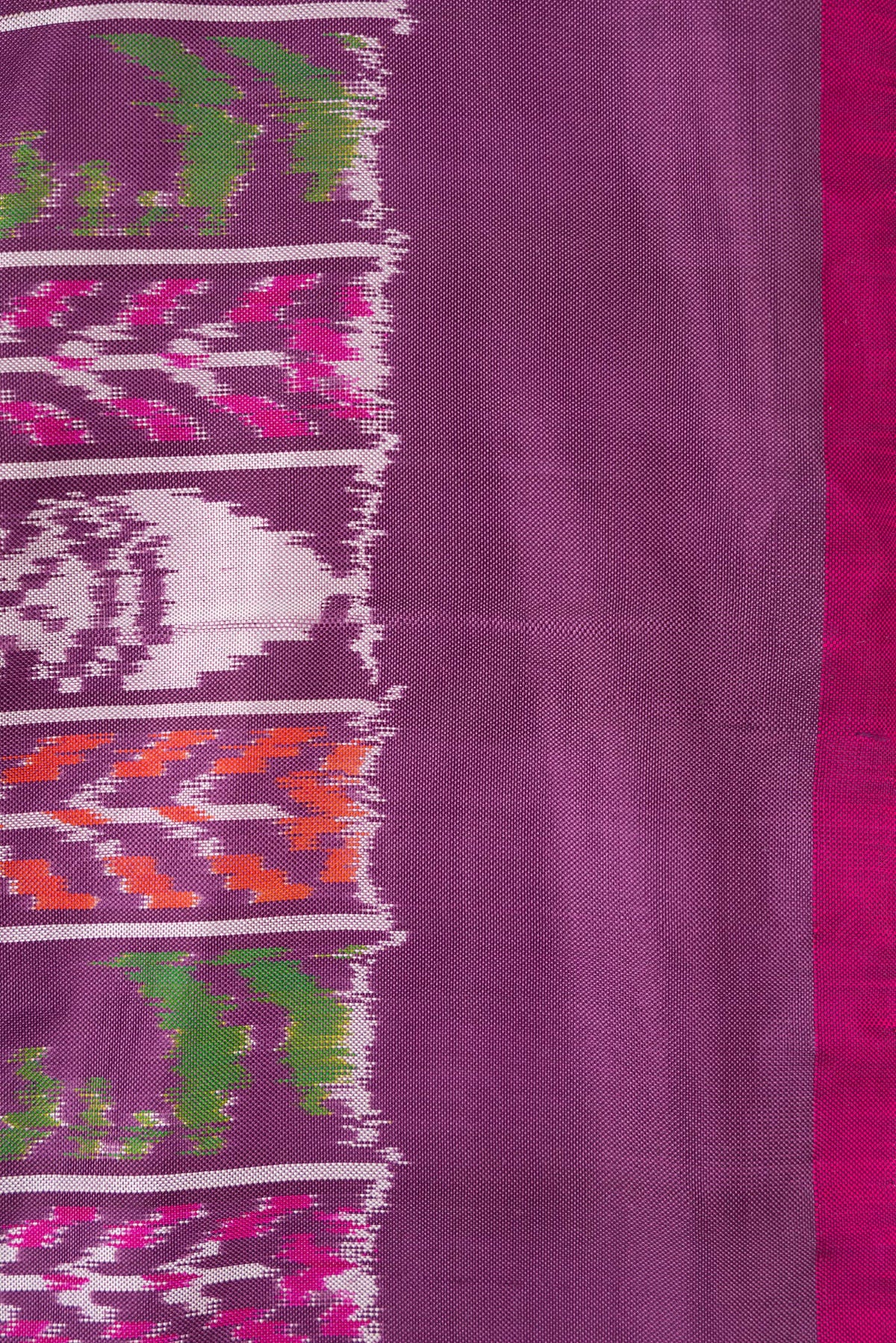 Border image of Purple Dual Tone Double Ikat Saree with Ikat Print on the body and Plain Border. 