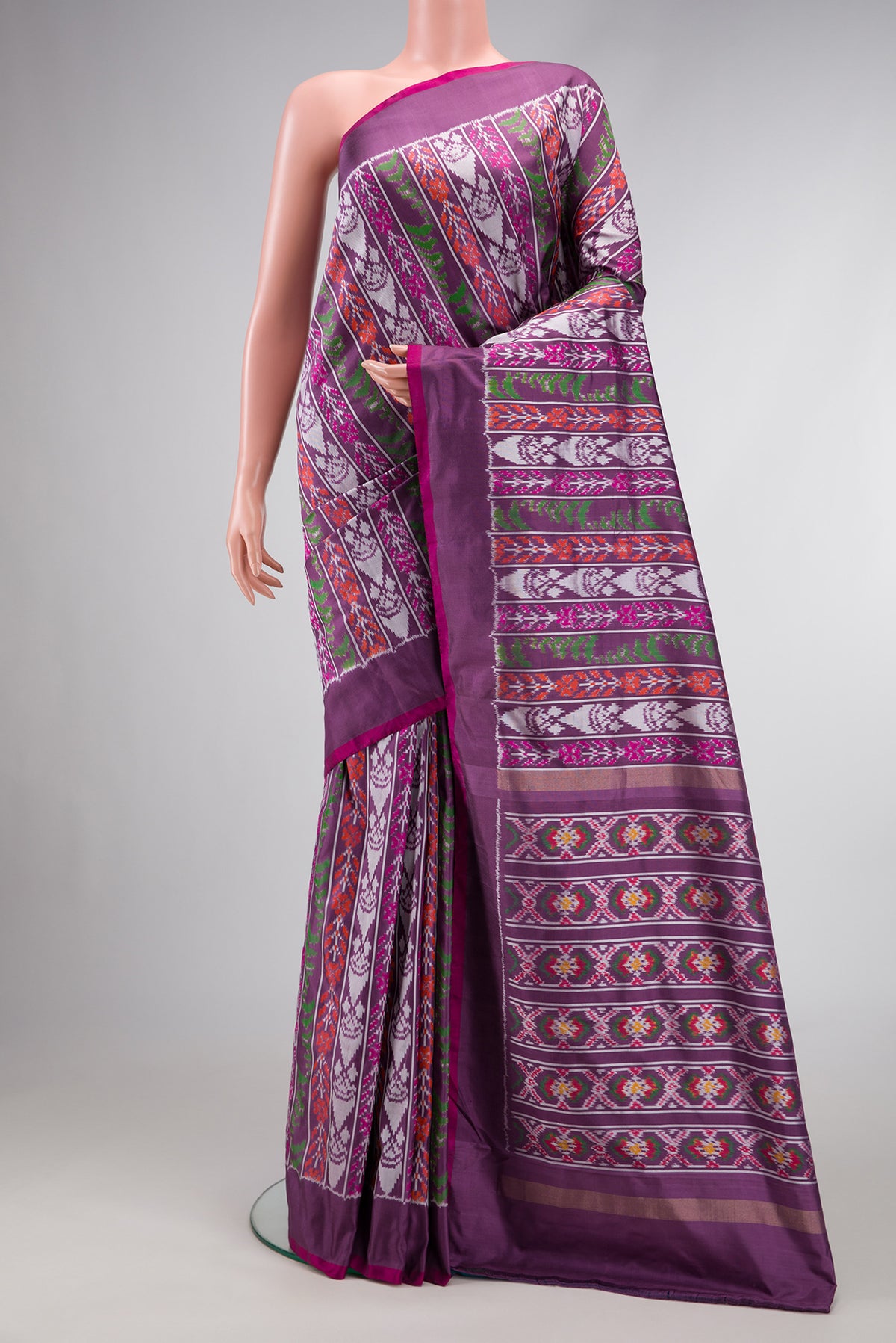 Purple Dual Tone Double Ikat Saree with Ikat Print on the body and Plain Border.  displayed on a mannequin