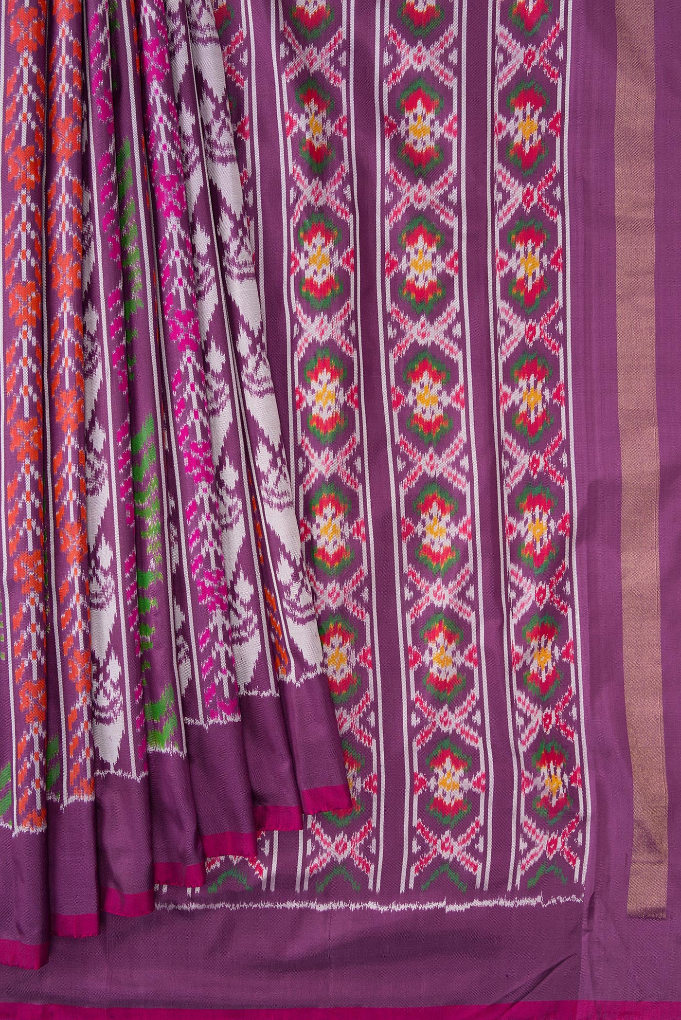 Pleats and pallu of Purple Dual Tone Double Ikat Saree with Ikat Print on the body and Plain Border. 
