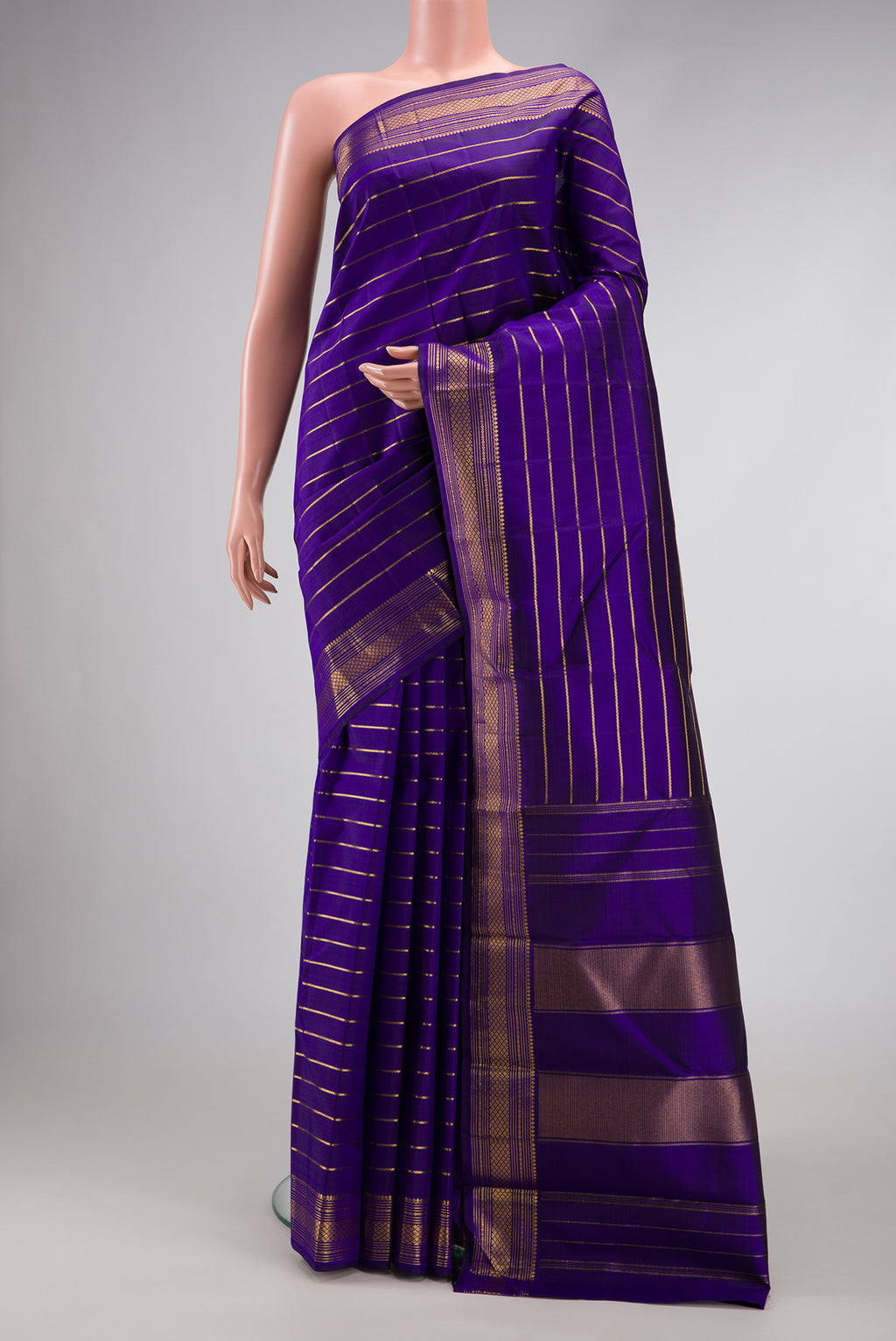 Royal Blue Dual Tone Kanjivaram Silk Saree with Stripes on the body and Zari Border.  displayed on a mannequin
