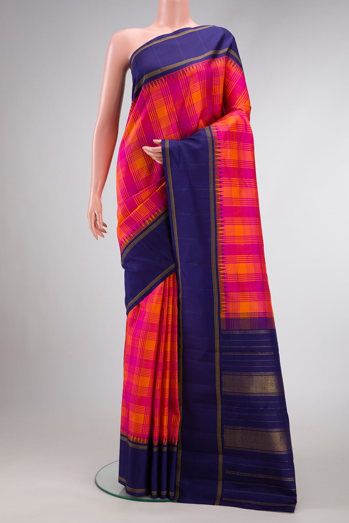 Pure Silk Pure Zari Orange and Pink Color Kanjivaram Saree with Checked design on the body and Zari Border.  displayed on a mannequin