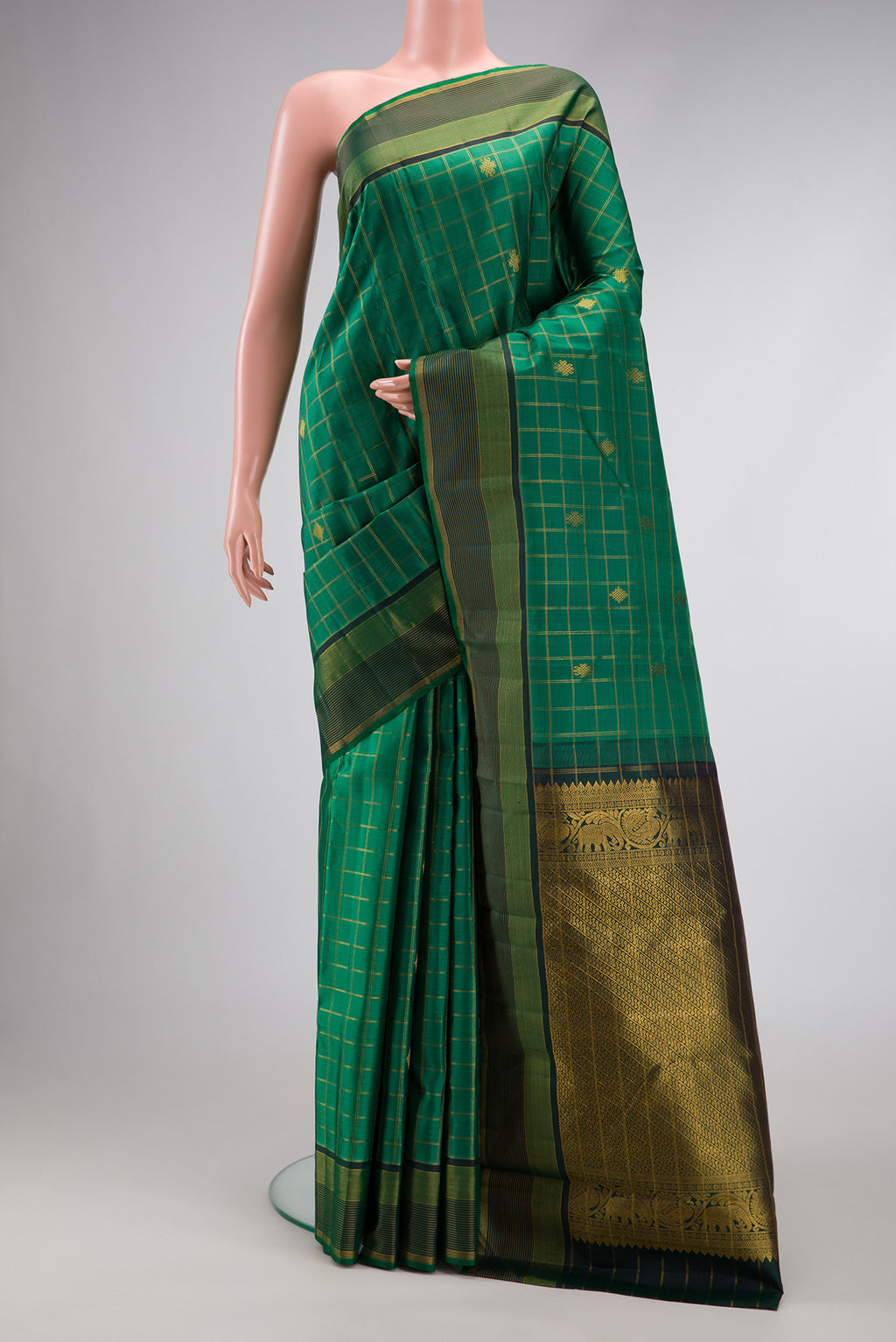 Green Dual Tone Kanjivaram Silk Saree with Checked design on the body and Zari Border.  displayed on a mannequin