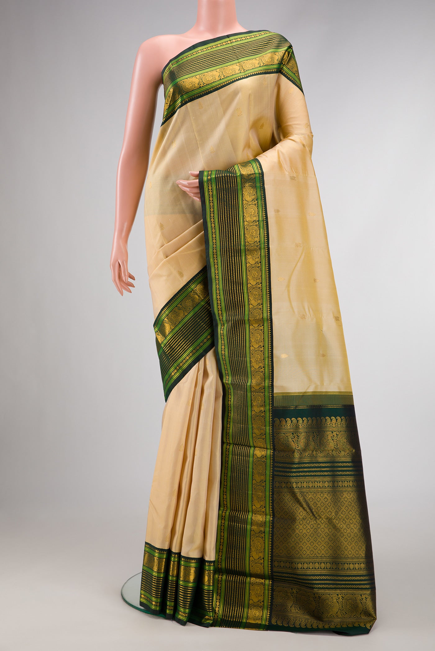 Pure Silk Pure Zari Sandal Dual Tone Kanchipuram Saree with Zari Butta on the body and Zari Border.  displayed on a mannequin