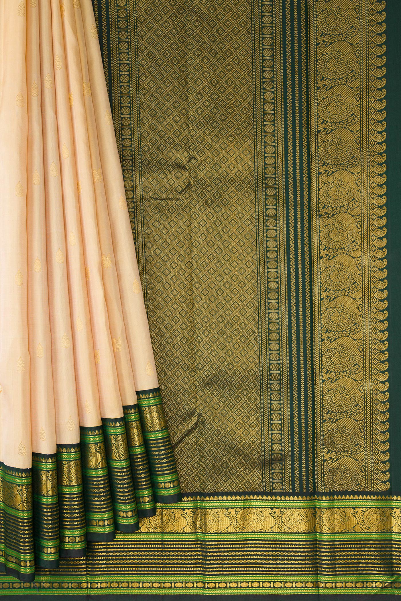 Pleats and pallu of Pure Silk Pure Zari Sandal Dual Tone Kanchipuram Saree with Zari Butta on the body and Zari Border. 
