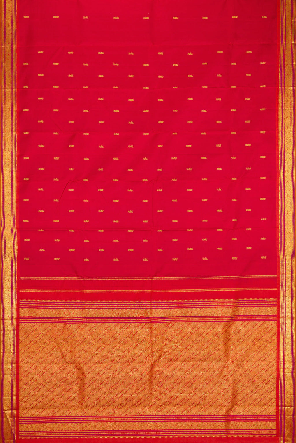Flat view of Red Kanjivaram Silk Saree with Zari Butta on the body and Zari Border. 