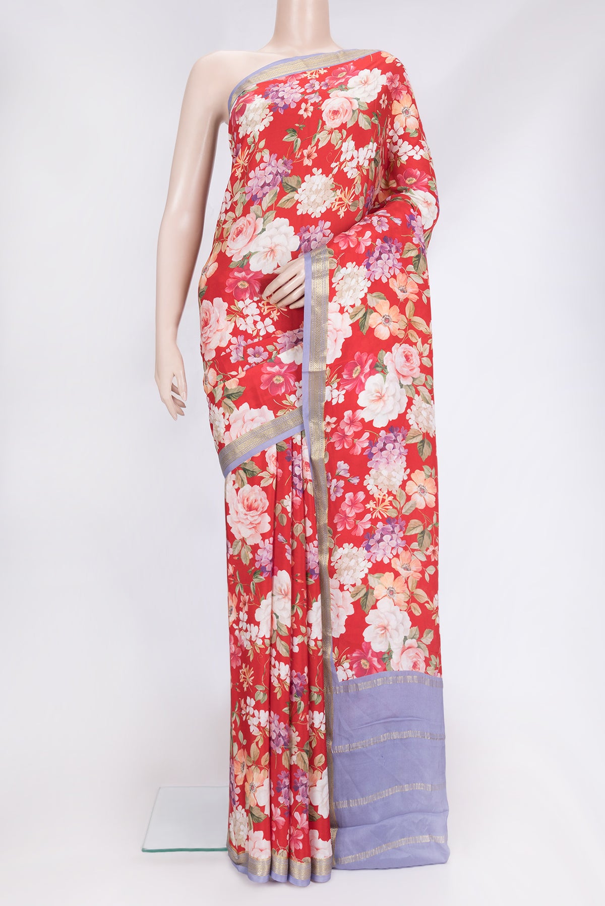 Red Dual Tone Mysore Crepe Saree with Printed design on the body and Zari Border.  displayed on a mannequin