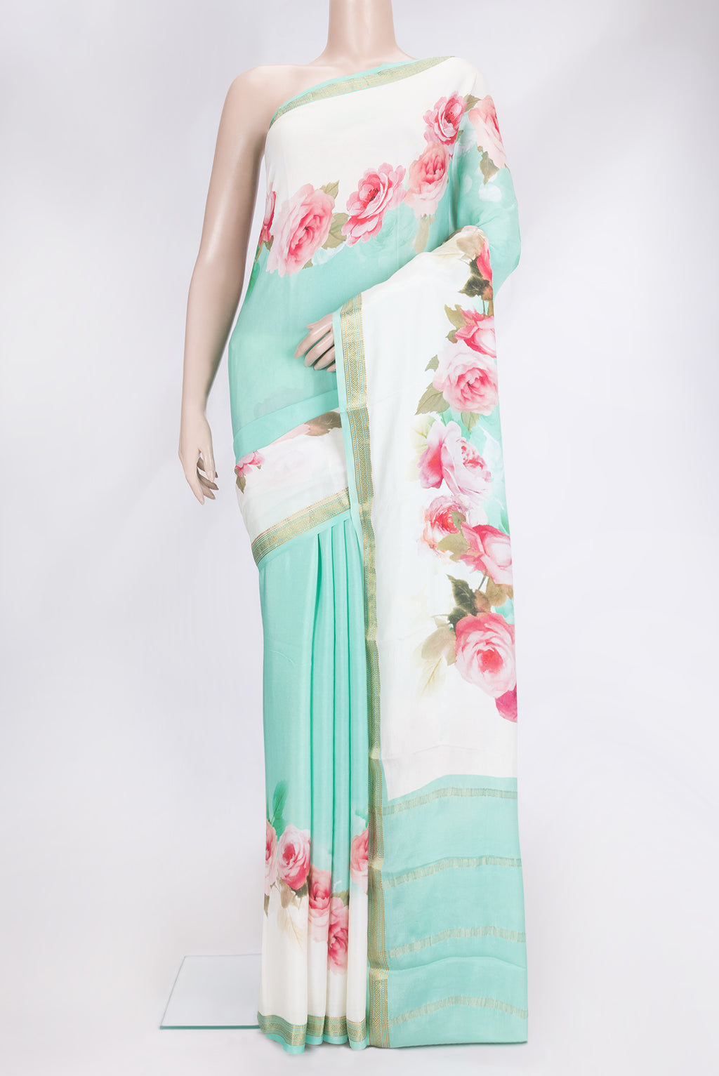 Green Dual Tone Mysore Crepe Saree with Printed design on the body and Zari Border.  displayed on a mannequin