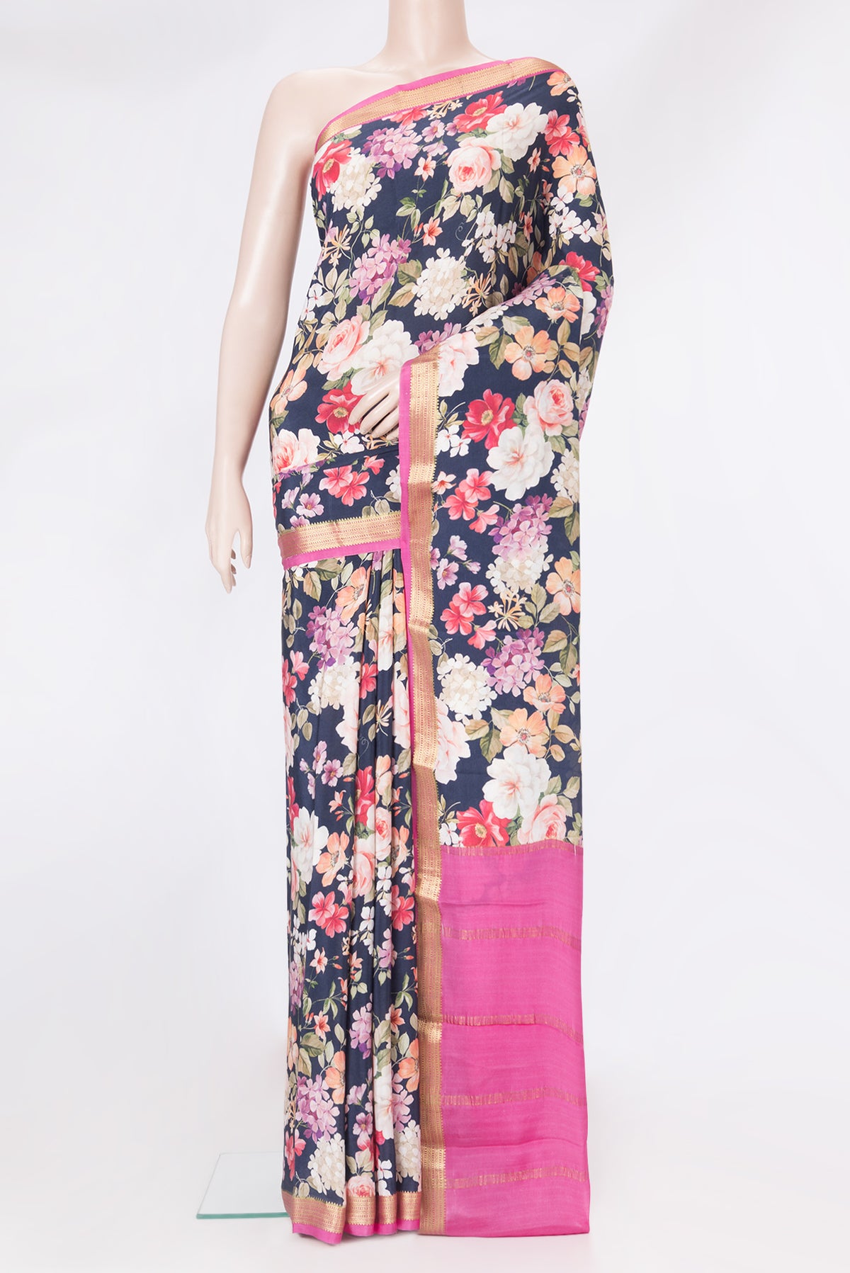Navy Blue Mysore Silk Saree with Floral Print on the body and Zari Border.  displayed on a mannequin