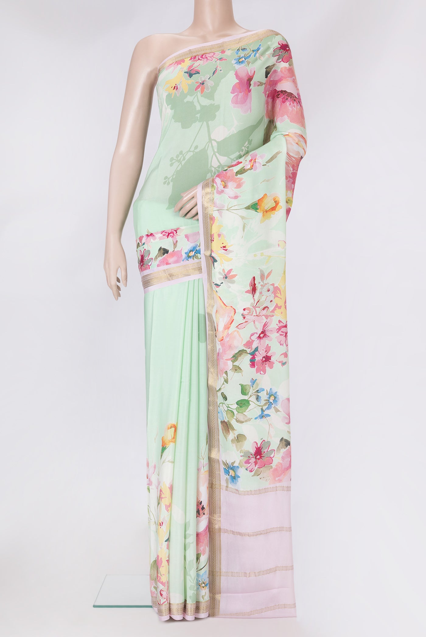 Pista Green Mysore Silk Saree with Printed design on the body and Zari Border.  displayed on a mannequin