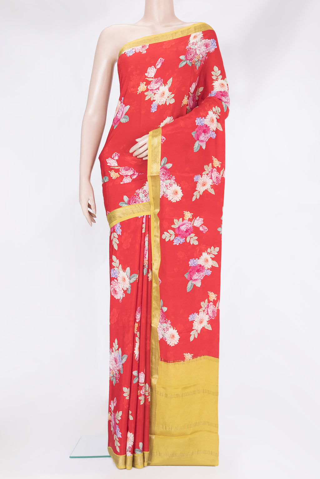 Red Crepe Saree with Floral Print on the body and Zari Border.  displayed on a mannequin