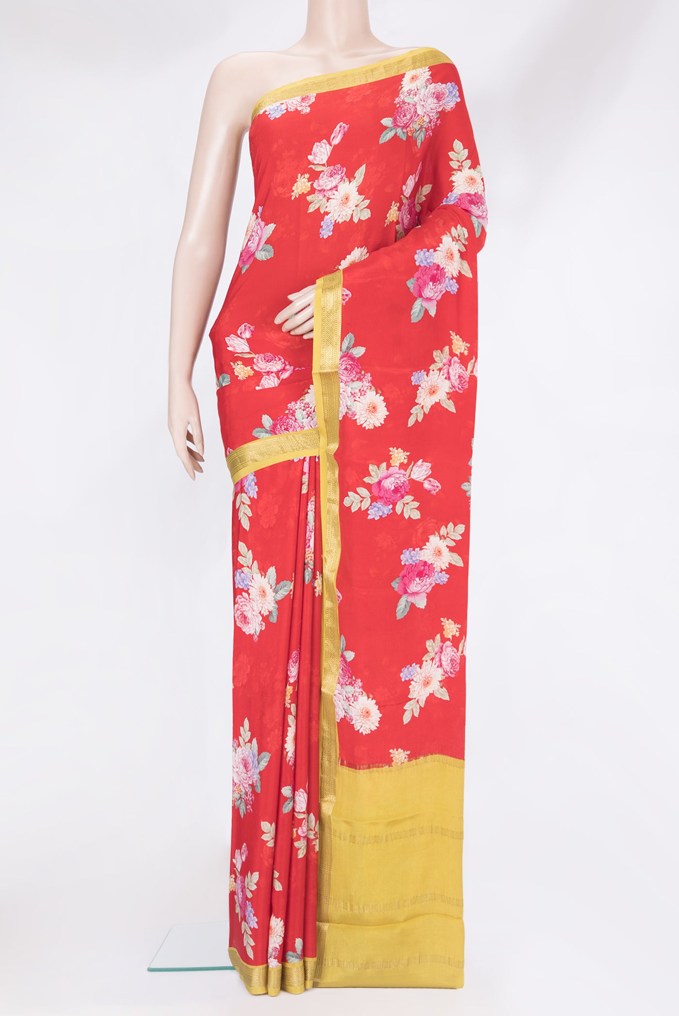 Red Crepe Saree with Floral Print on the body and Zari Border.  displayed on a mannequin