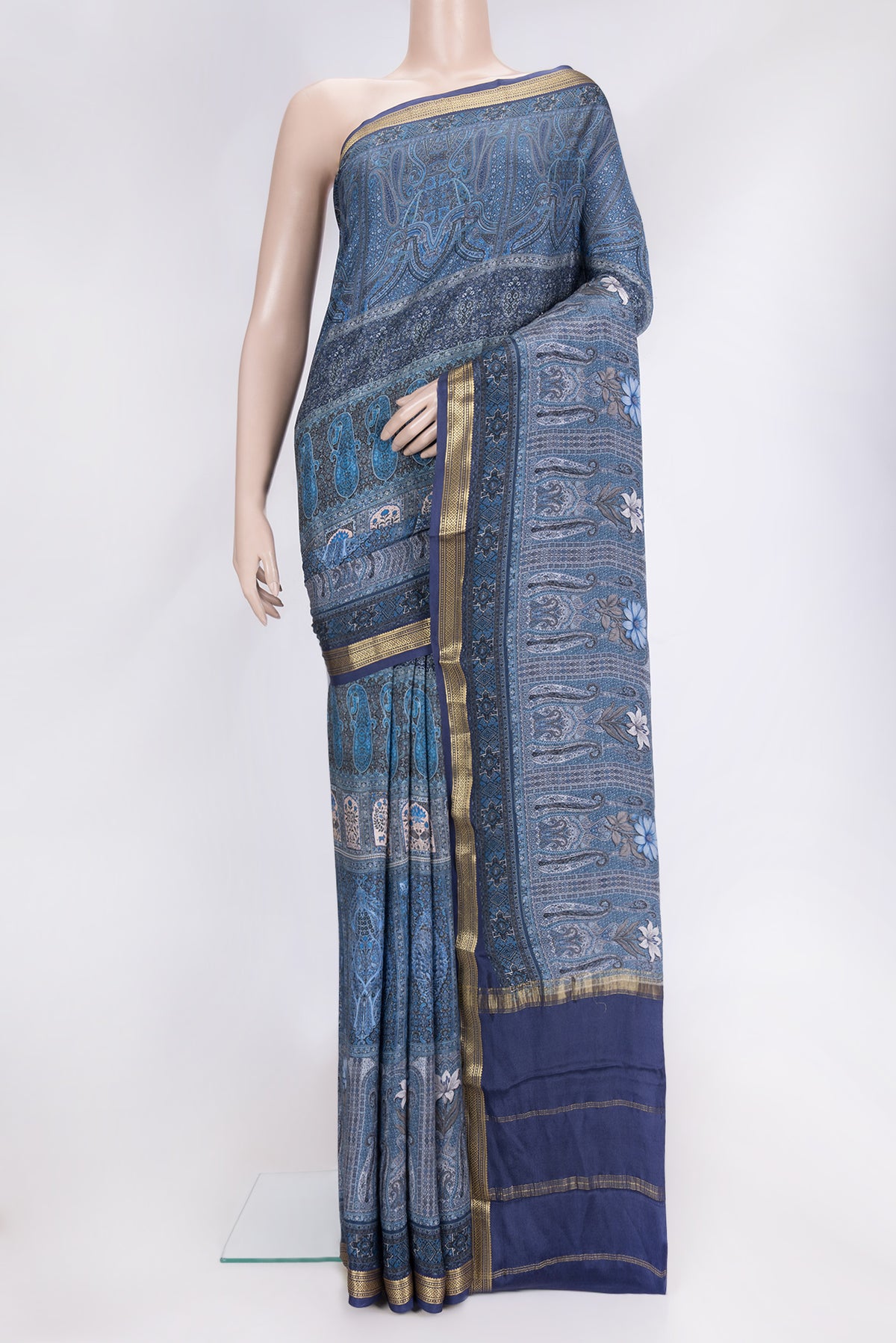 Navy Blue Dual Tone Mysore Crepe Saree with Printed design on the body and Zari Border.  displayed on a mannequin