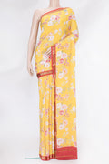 Yellow Mysore Crepe Saree with Floral Print on the body and Zari Border.  displayed on a mannequin