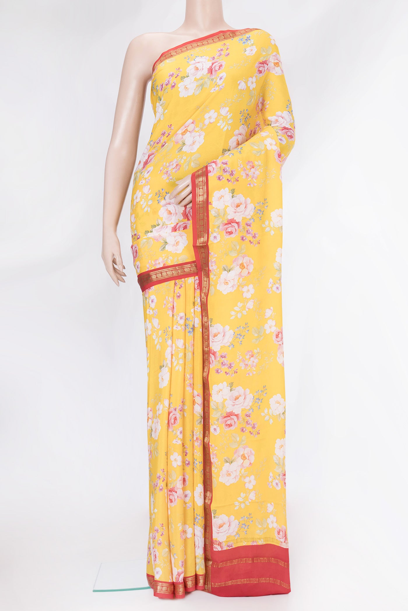 Yellow Mysore Crepe Saree with Floral Print on the body and Zari Border.  displayed on a mannequin