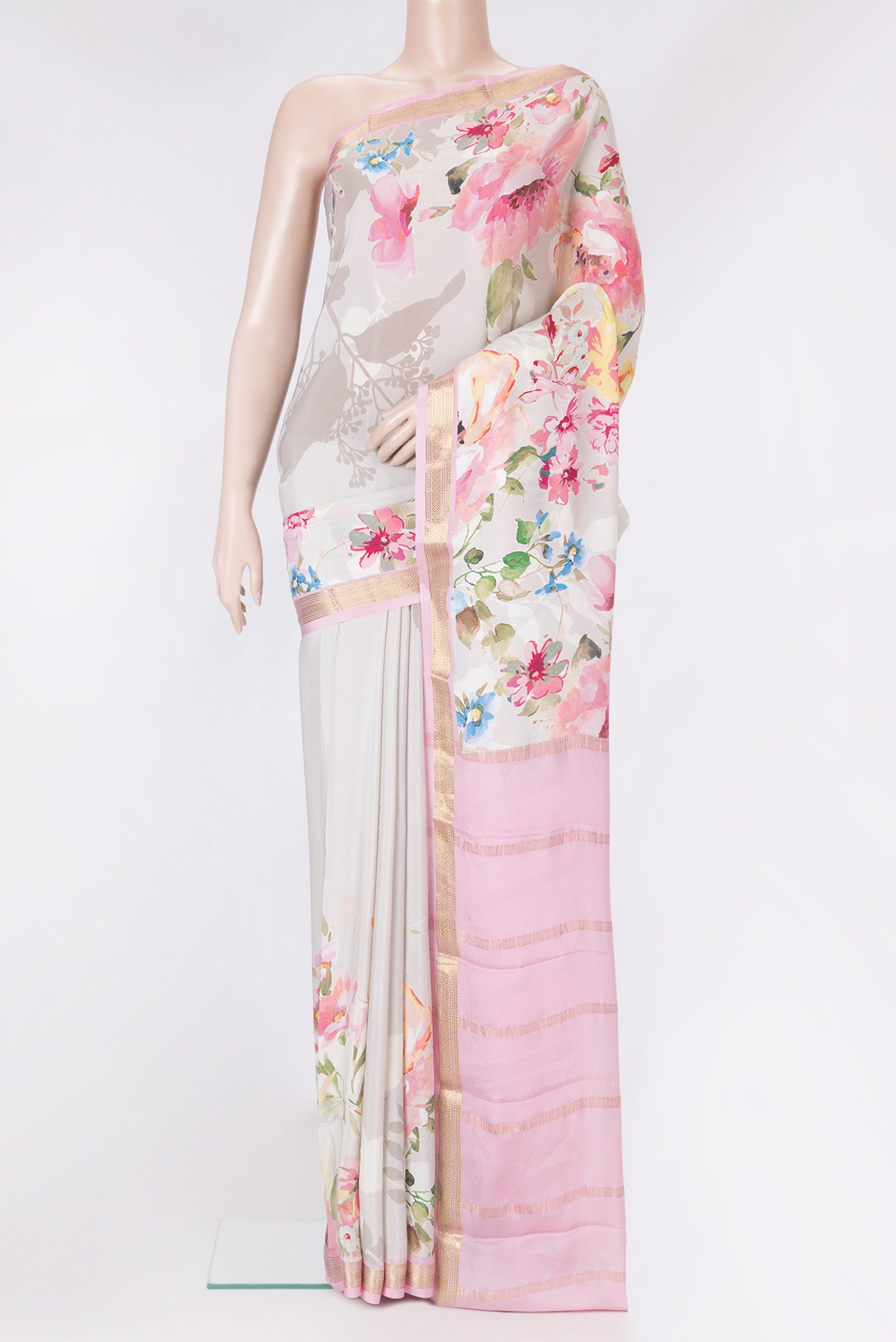 Beige Mysore Silk Saree with Printed design on the body and Zari Border.  displayed on a mannequin