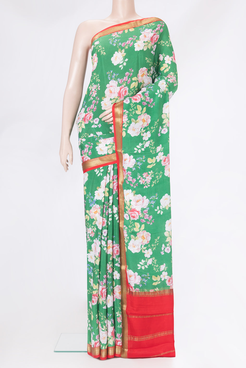 Green Mysore Silk Saree with Floral Print on the body and Zari Border.  displayed on a mannequin