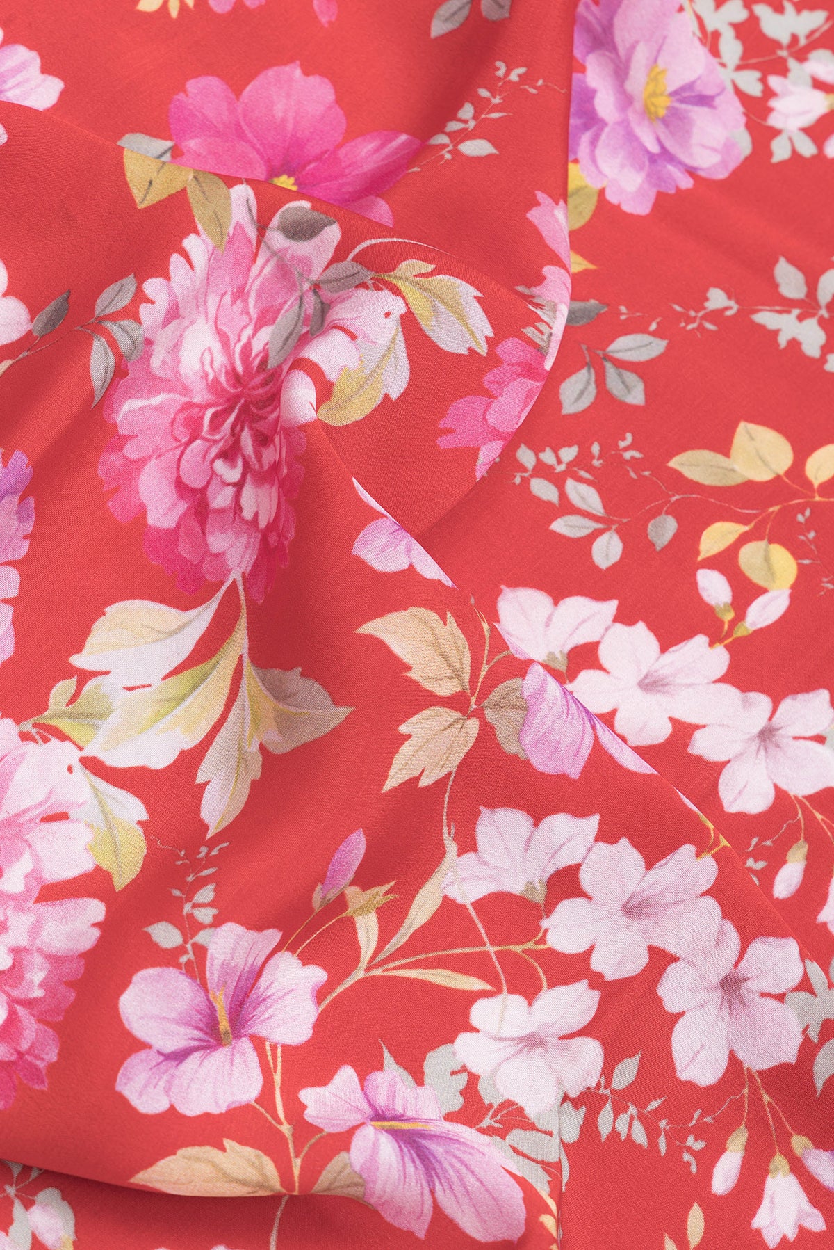 Close up of Red Dual Tone Mysore Crepe Saree with Printed design on the body and Zari Border.  displaying folds