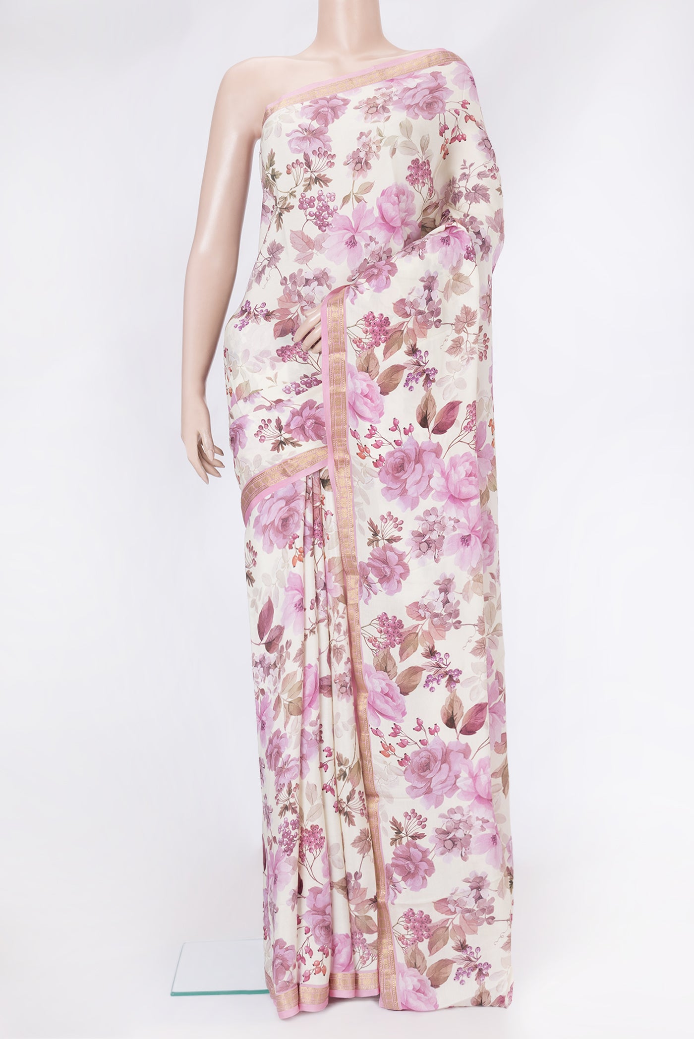 Off White Mysore Crepe Saree with Printed design on the body and Zari Border.  displayed on a mannequin