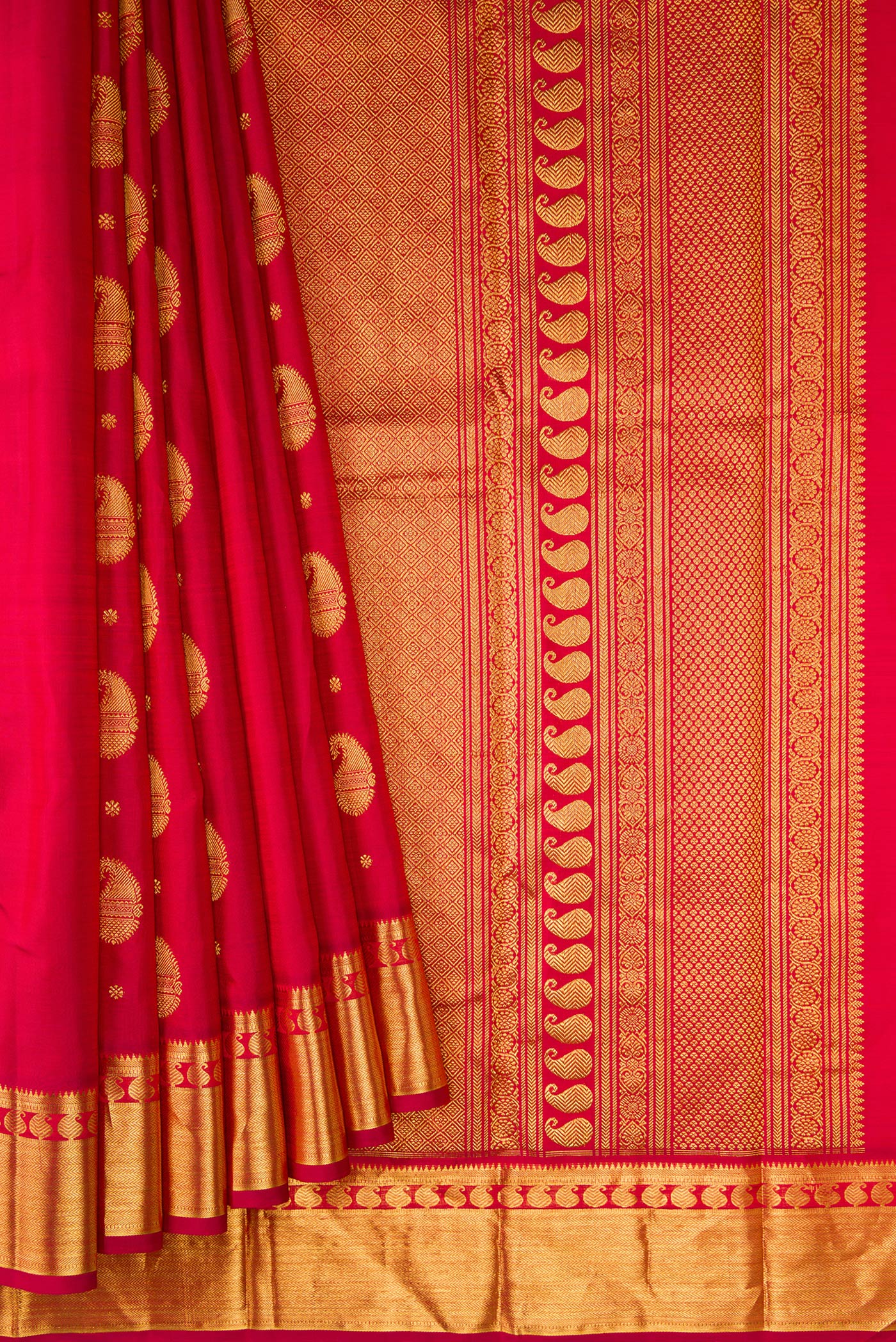 Pleats and pallu of Pure Silk Pure Zari Red Dual Tone Kanjivaram Saree with Zari Butta on the body and Zari Border. 