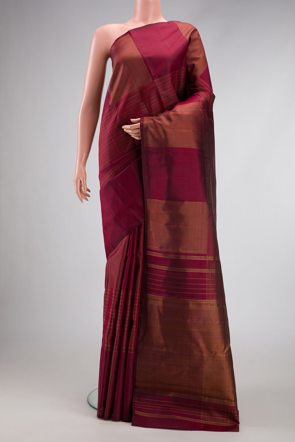 Pure Silk Pure Zari Burgundy Dual Tone Kanchipuram Saree with Stripes on the body and Without Border.  displayed on a mannequin