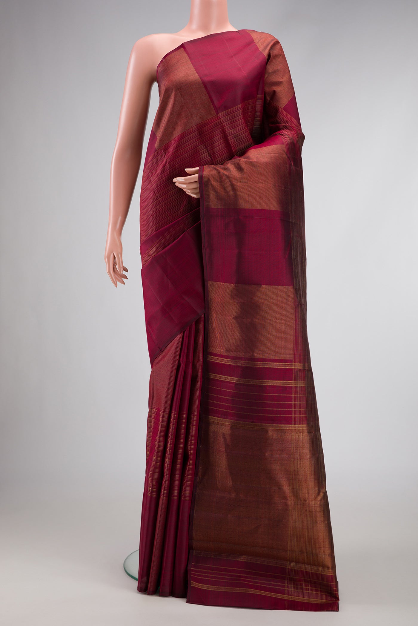 Pure Silk Pure Zari Burgundy Dual Tone Kanchipuram Saree with Stripes on the body and Without Border.  displayed on a mannequin