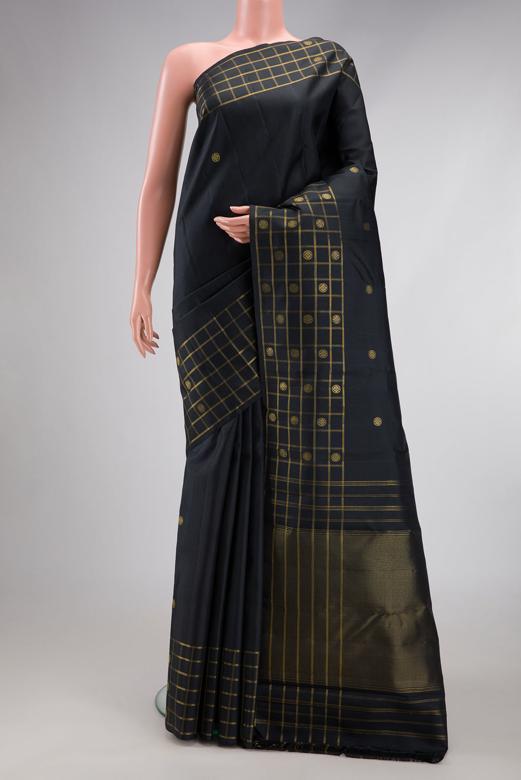 Black Kanchipuram Silk Saree with Zari Butta on the body and Checks Border.  displayed on a mannequin