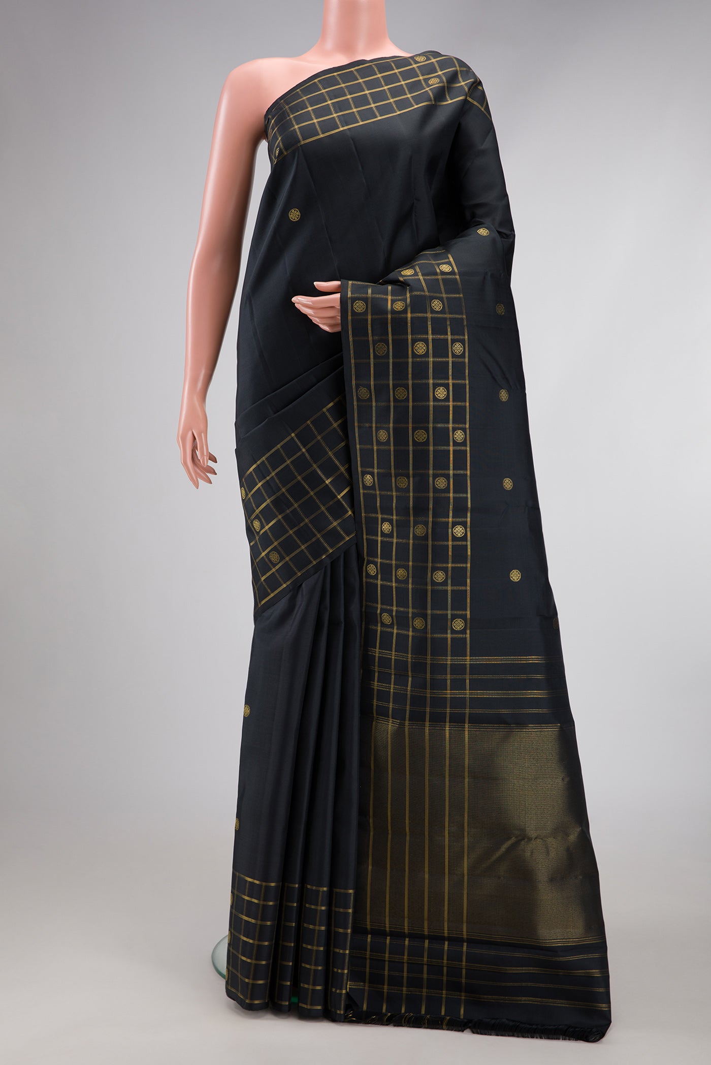 Black Kanchipuram Silk Saree with Zari Butta on the body and Checks Border.  displayed on a mannequin