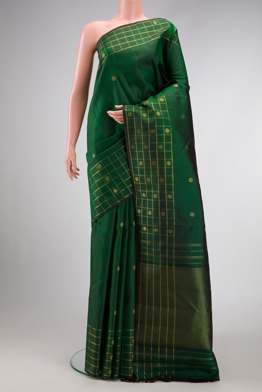 Pure Silk Pure Zari Green Dual Tone Kanchipuram Saree with Zari Butta on the body and Zari Border.  displayed on a mannequin