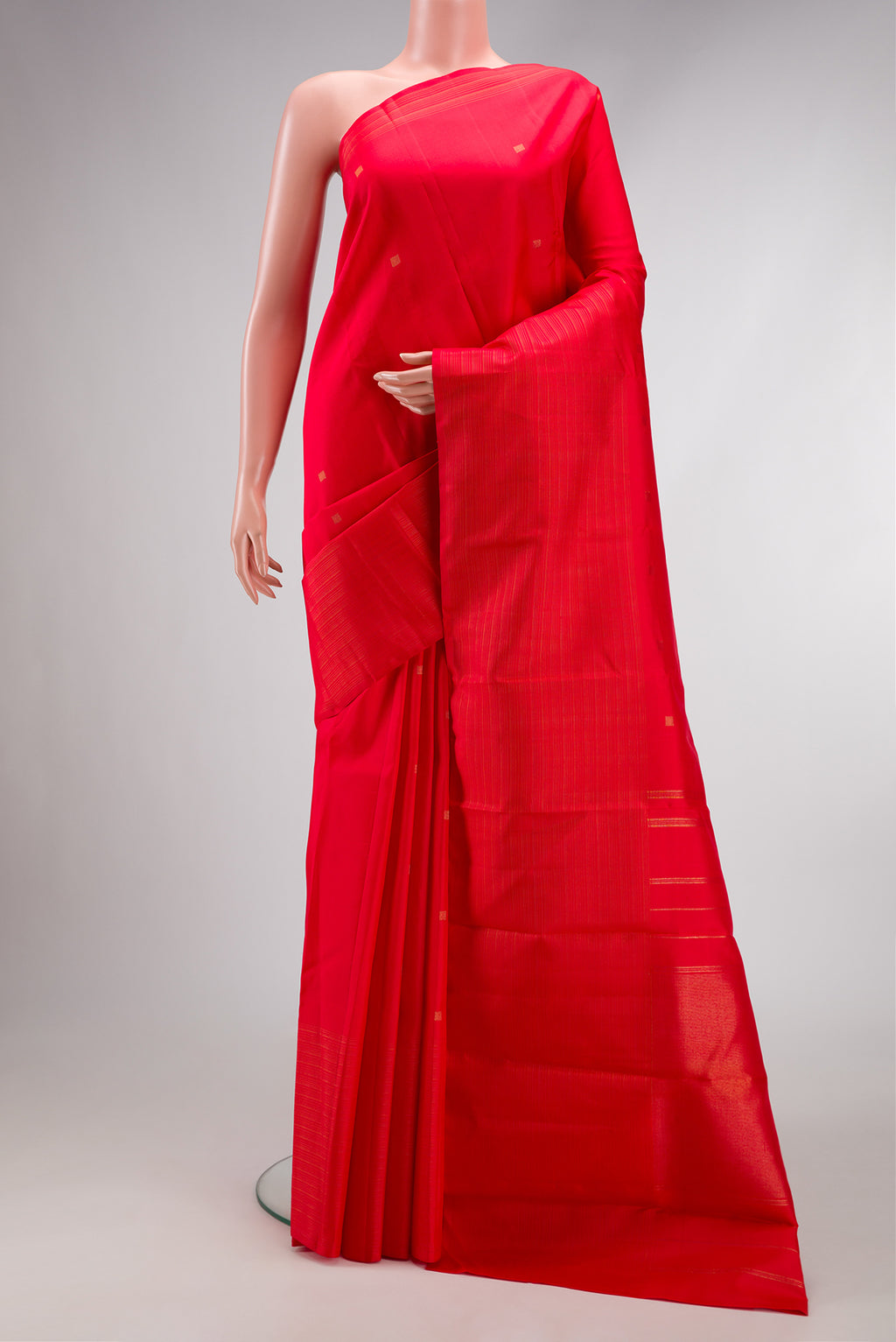 Pure Silk Pure Zari Red Dual Tone Kanchipuram Saree with Zari Butta on the body and Without Border.  displayed on a mannequin