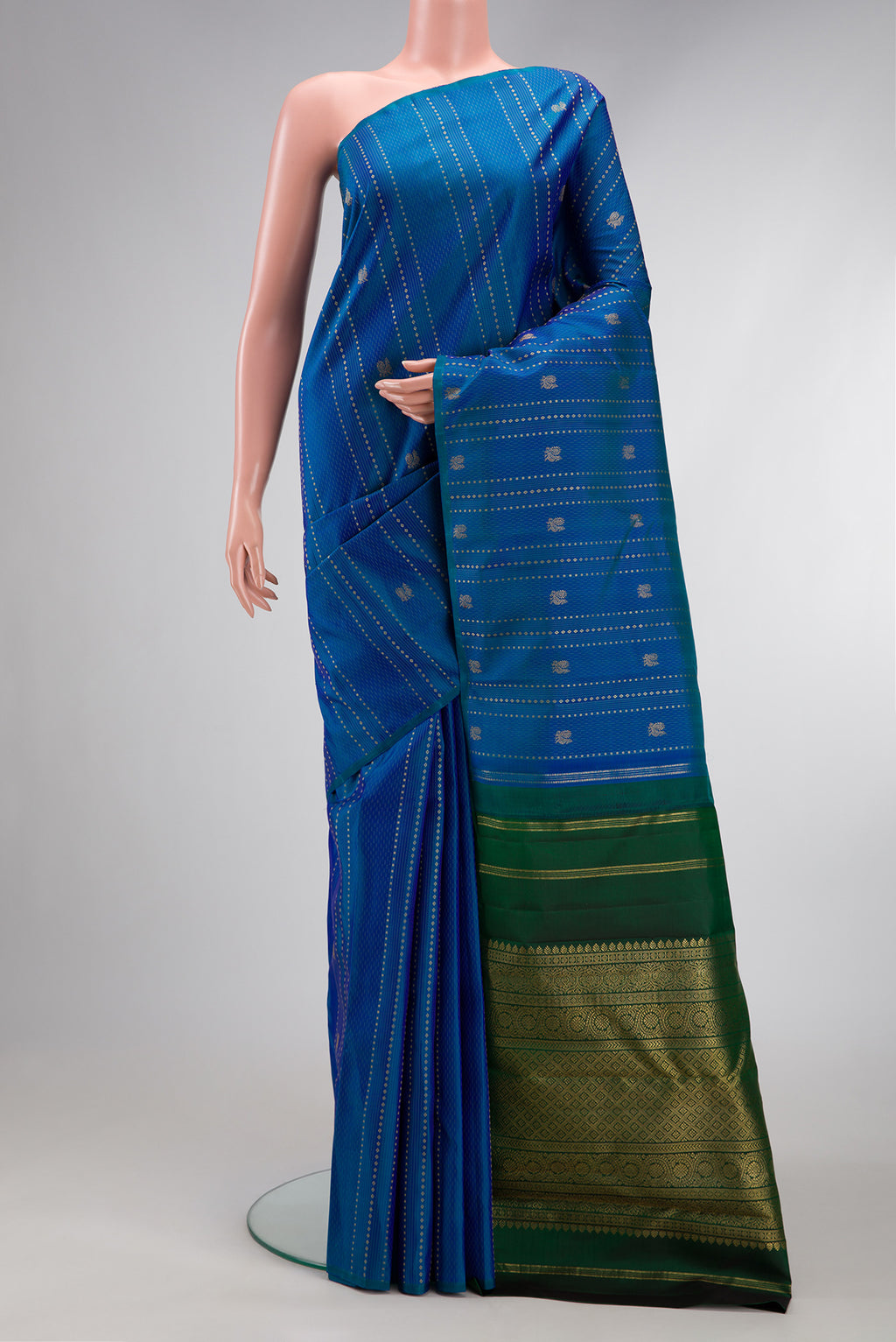 Peacock Blue Dual Tone Kanchipuram Silk Saree with Stripes on the body and Without Border.  displayed on a mannequin