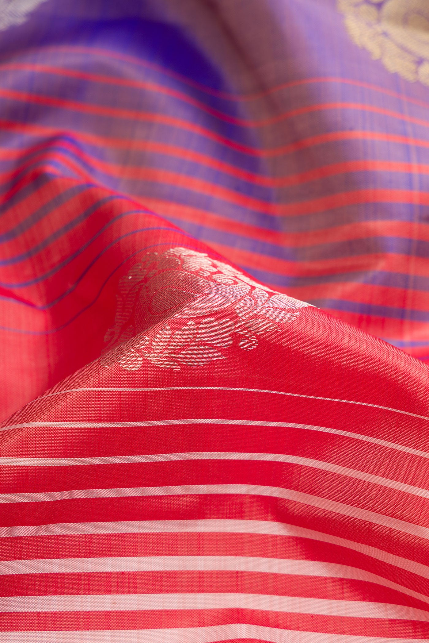 Close up of Maroon, Beige and Navy Blue Color Kanchipuram Silk Saree with Stripes on the body and Without Border.  displaying folds
