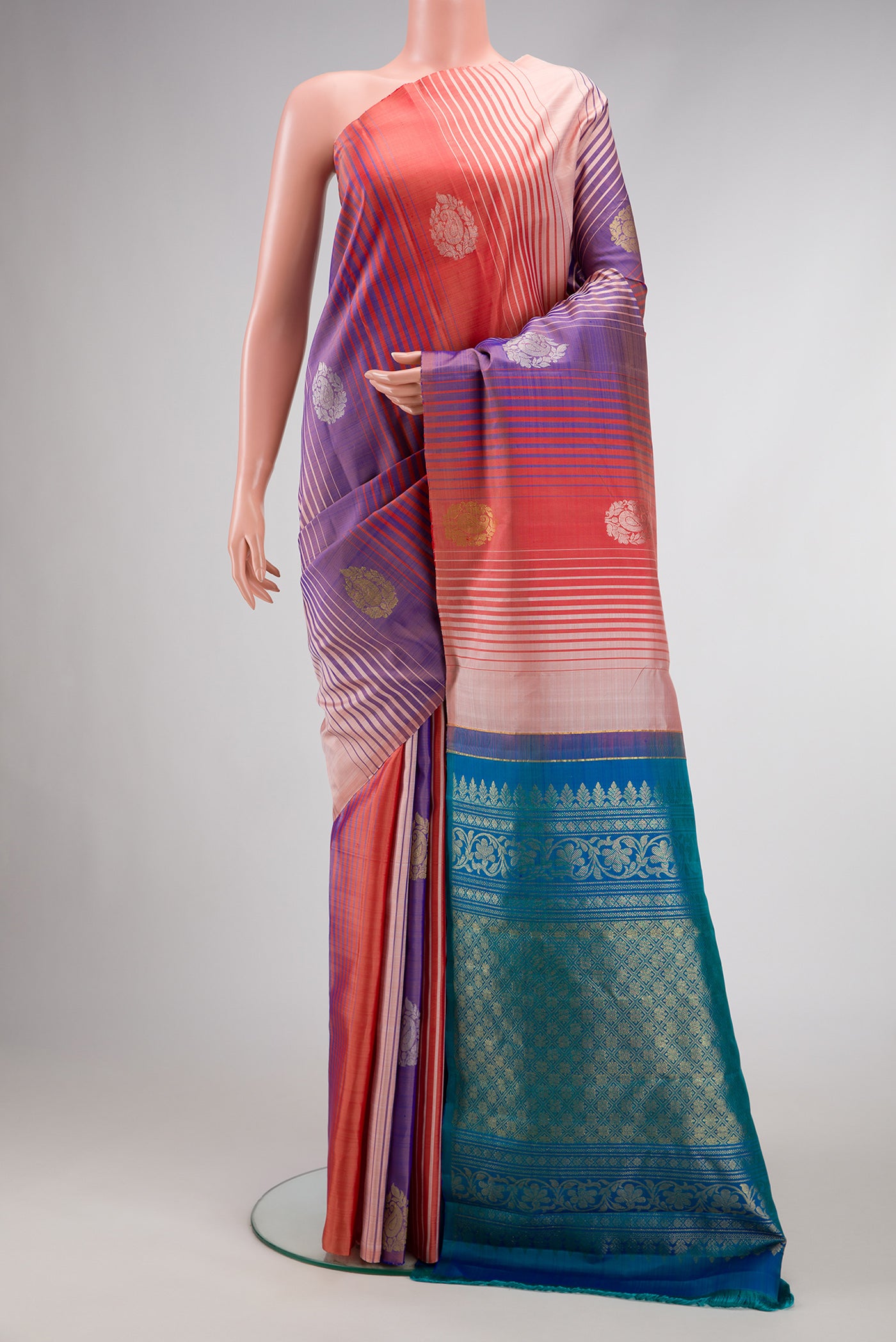 Maroon, Beige and Navy Blue Color Kanchipuram Silk Saree with Stripes on the body and Without Border.  displayed on a mannequin